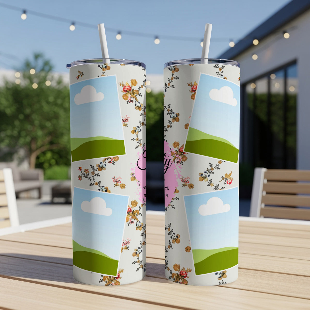 Two tumblers with a floral collage design featuring clouds and hills.
