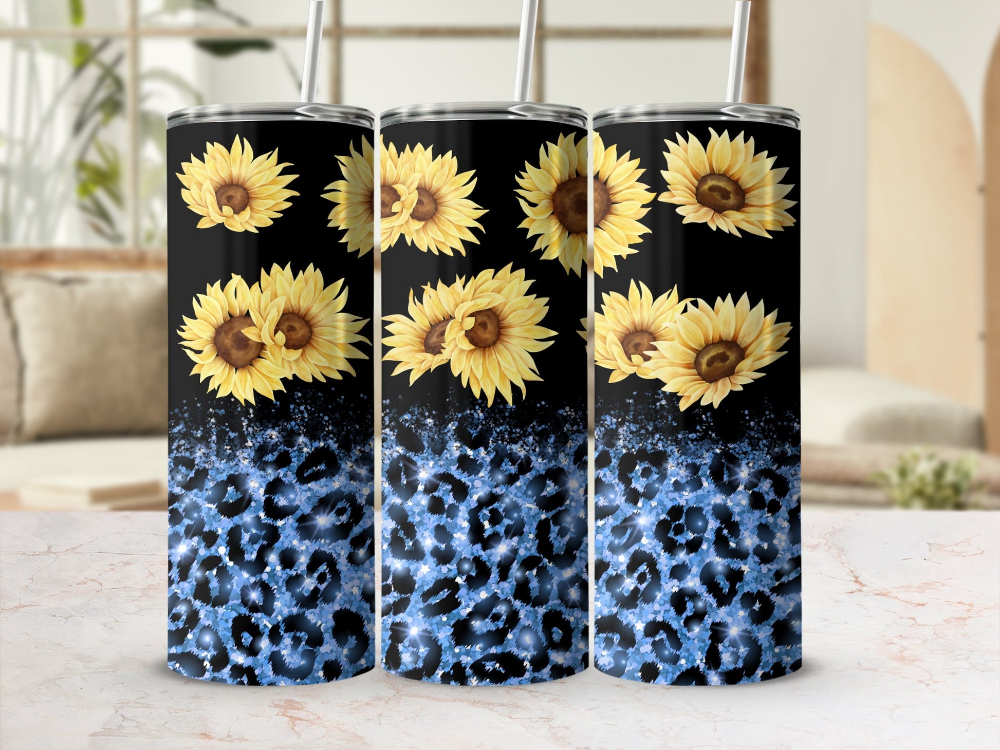 Three tumblers with sunflowers and blue leopard print.