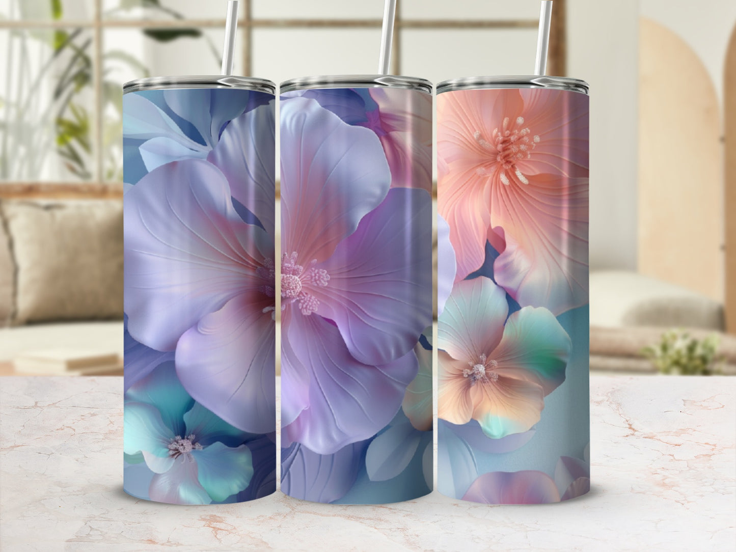 Three tumblers with floral watercolor designs in blue, purple, and pink.