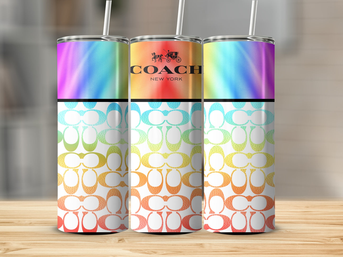 Three tumblers with Coach logo and a rainbow gradient design.