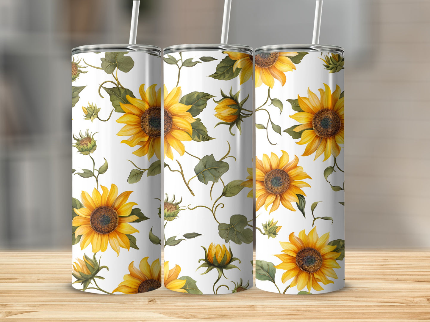 White tumblers with a repeating pattern of yellow sunflowers and green leaves.