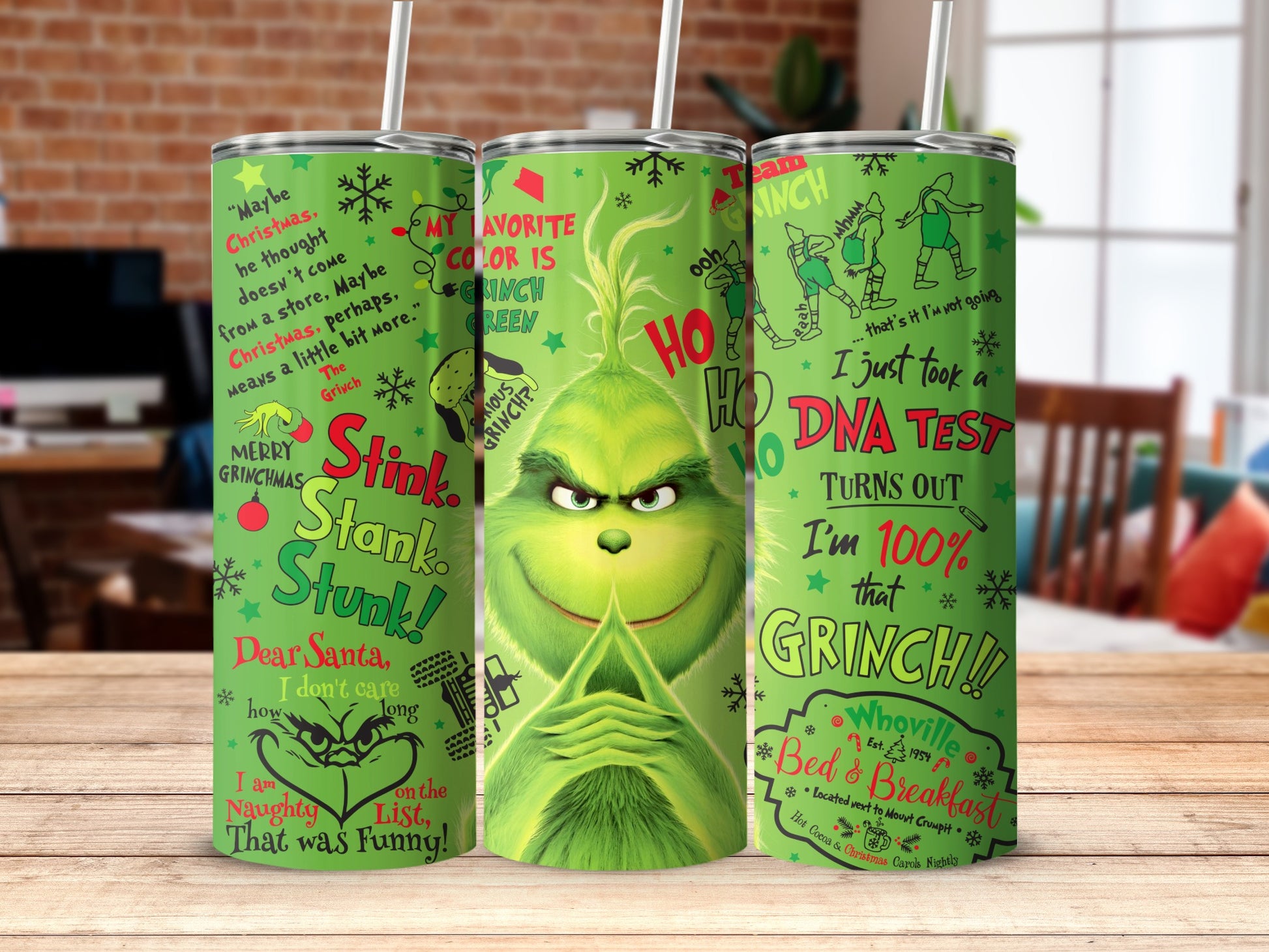 Grinchy green tumbler with Christmas phrases and illustrations.