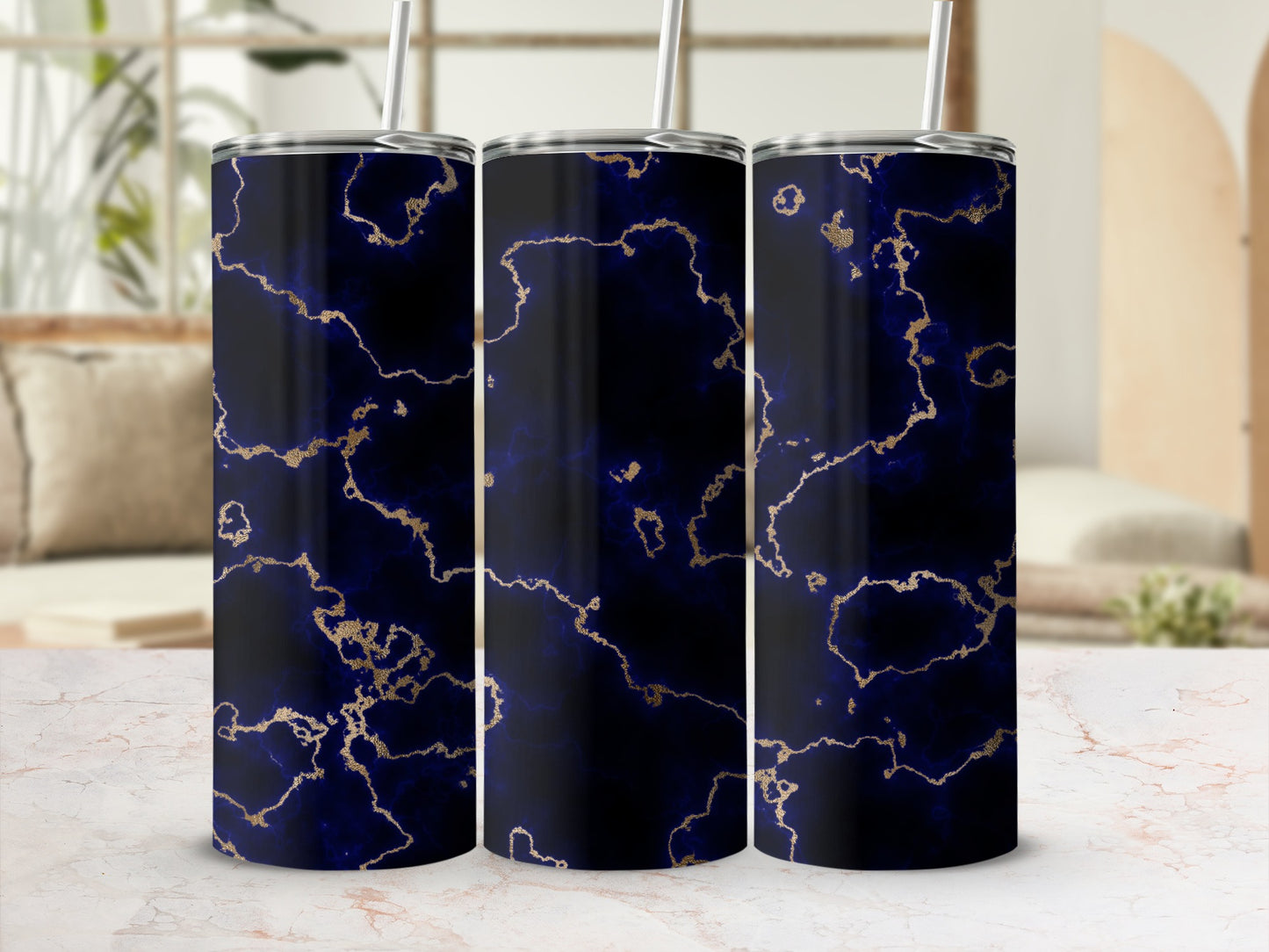 Three tumblers with a dark blue and gold marble pattern.
