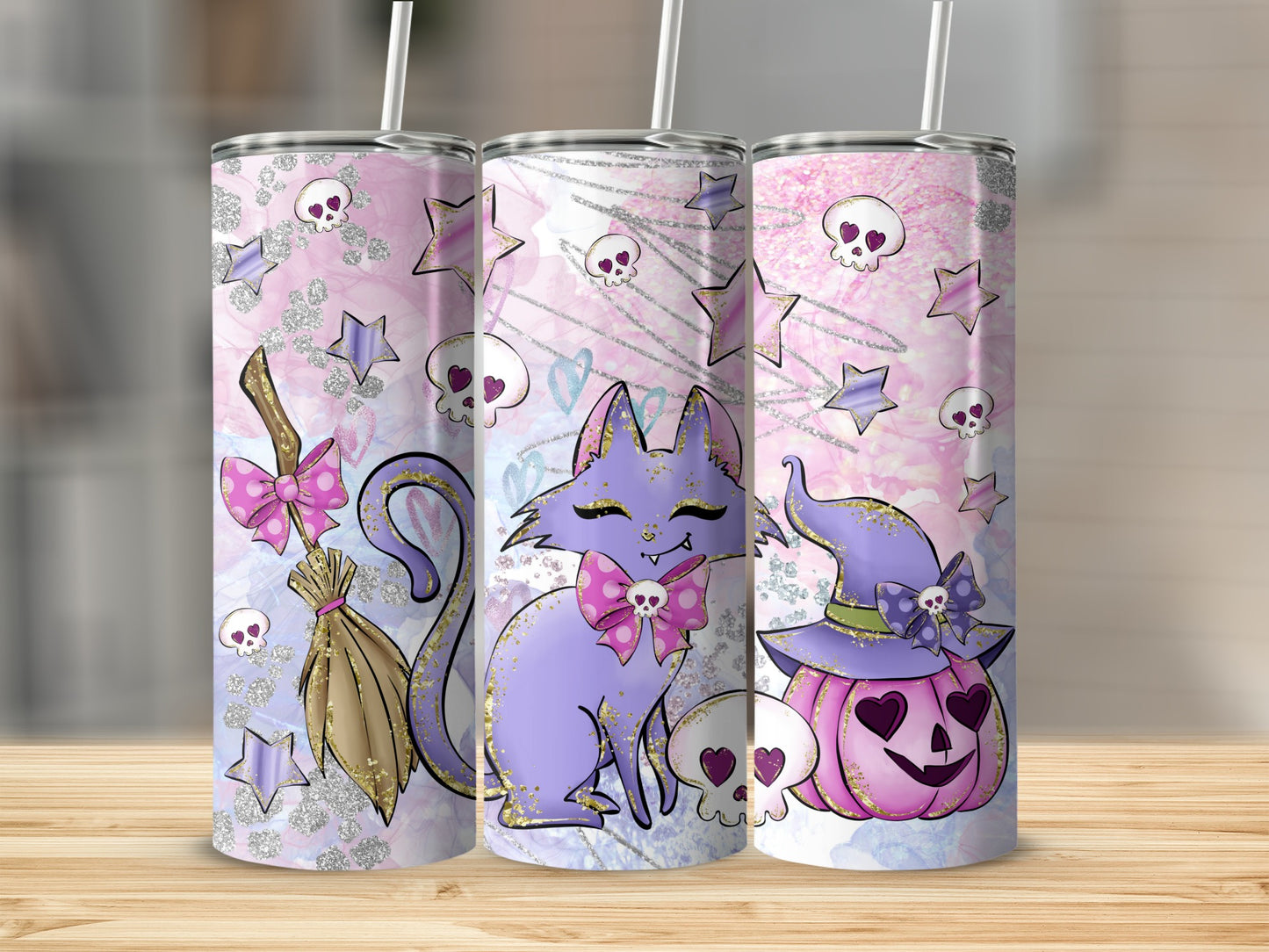 Three purple and pink Halloween tumblers with cats, pumpkins, and skulls.