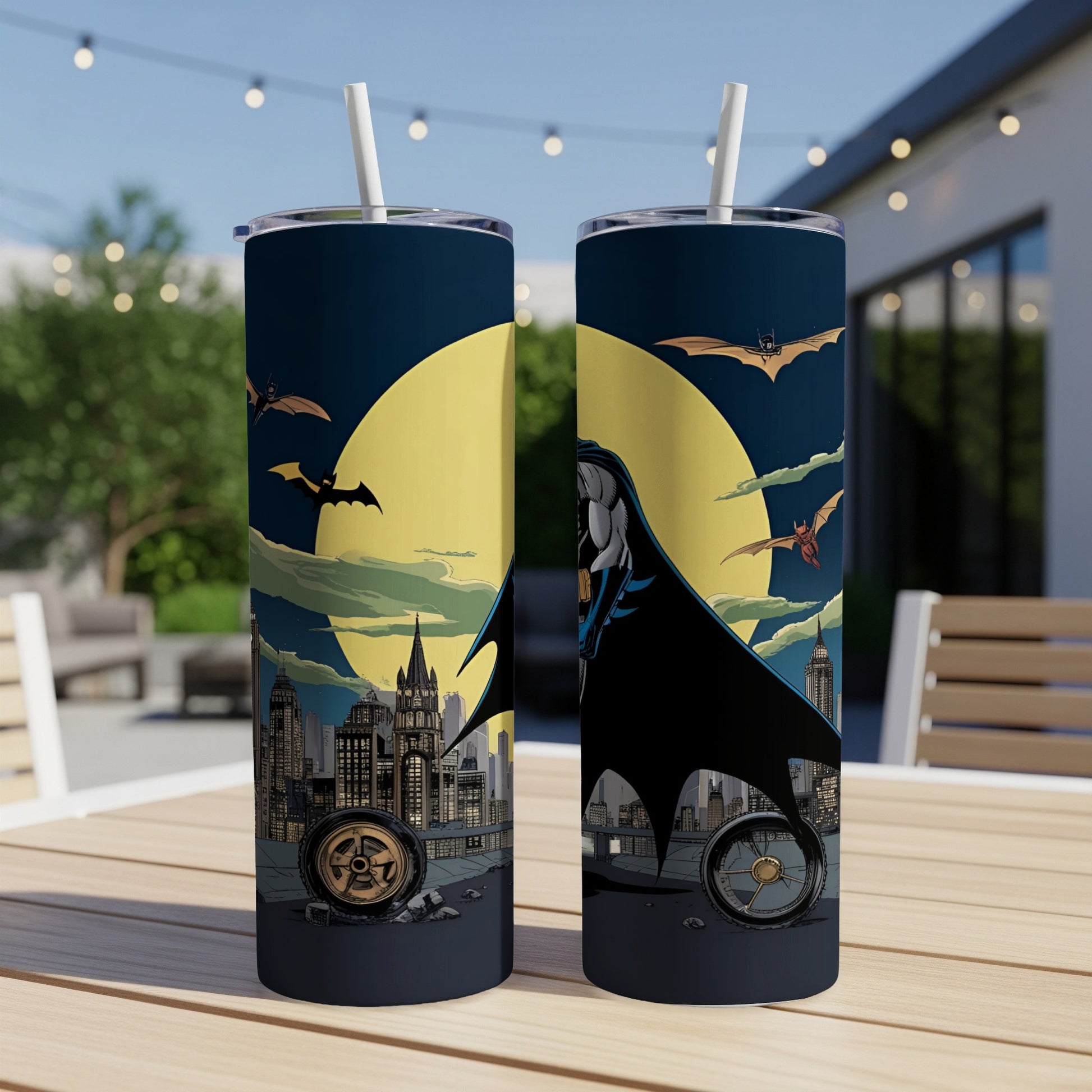 Batman artwork on a tumbler with a city skyline and full moon.