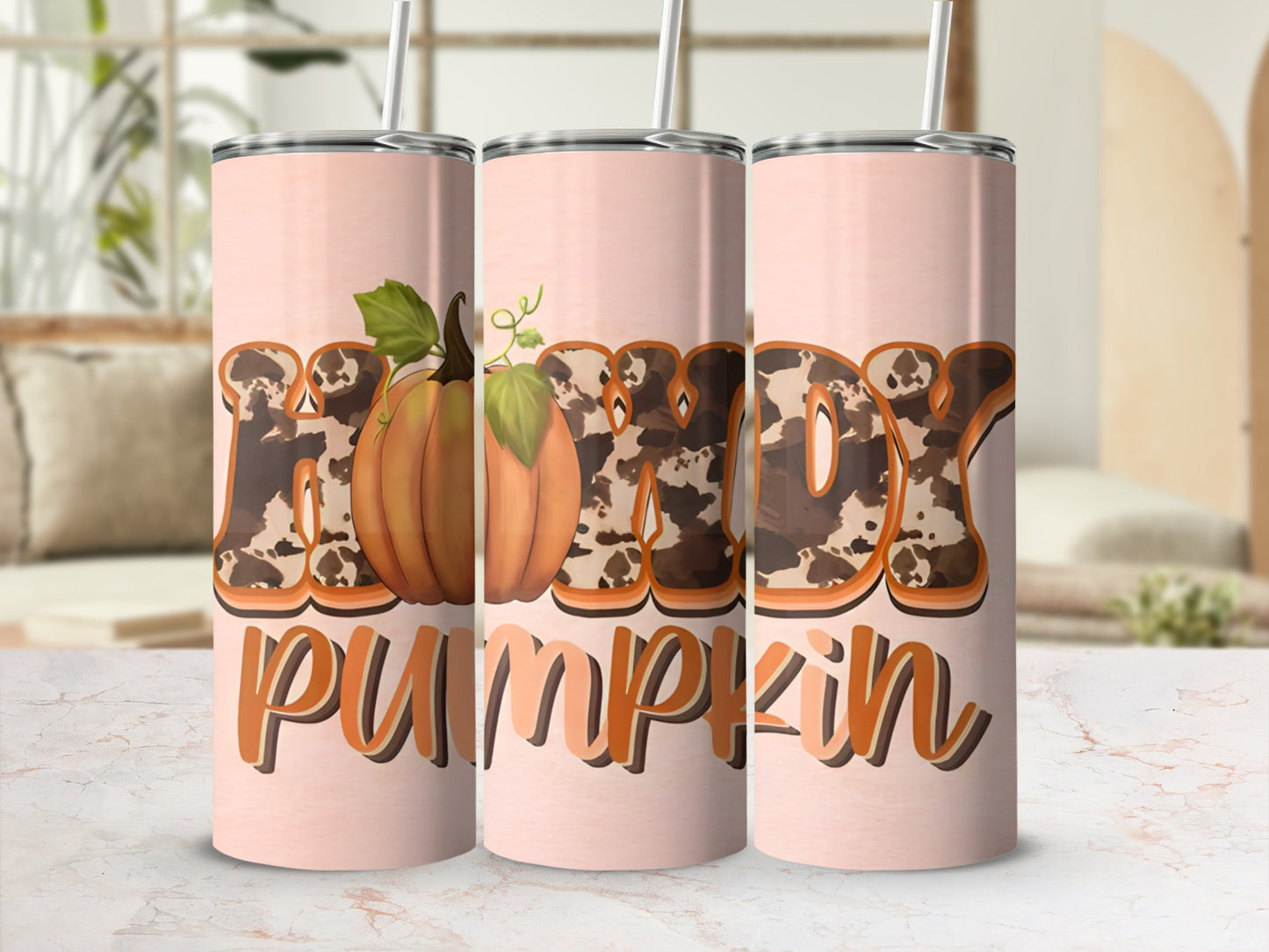 "Lady Pumpkin" text with cow print and pumpkin graphic on a pink tumbler.