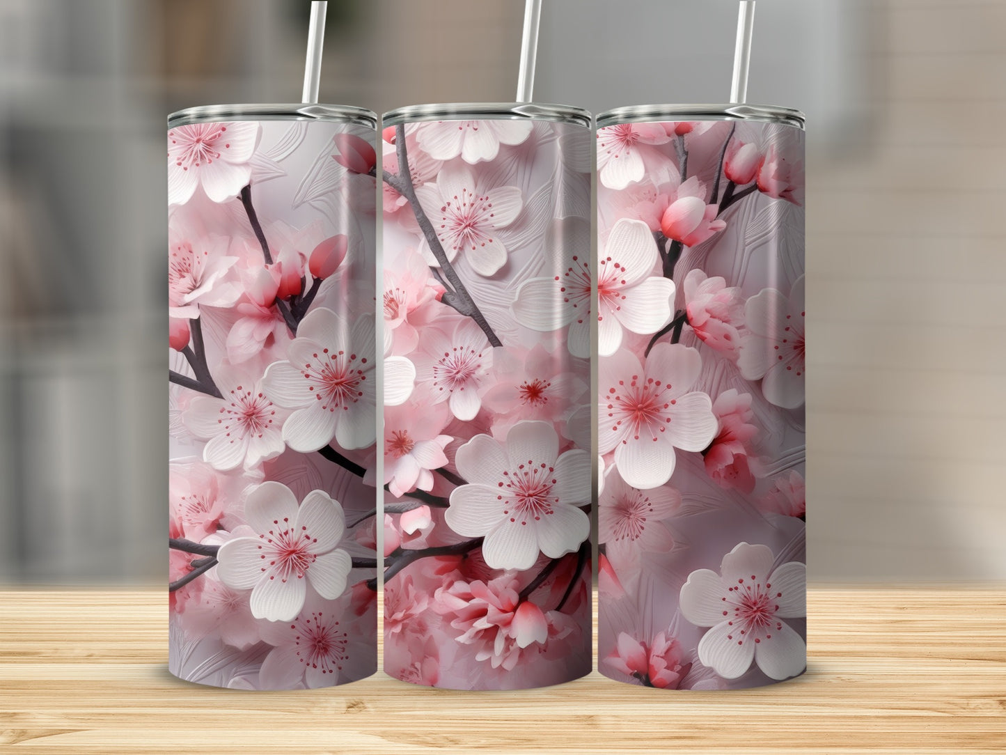 Three tumblers with a pink cherry blossom floral design.
