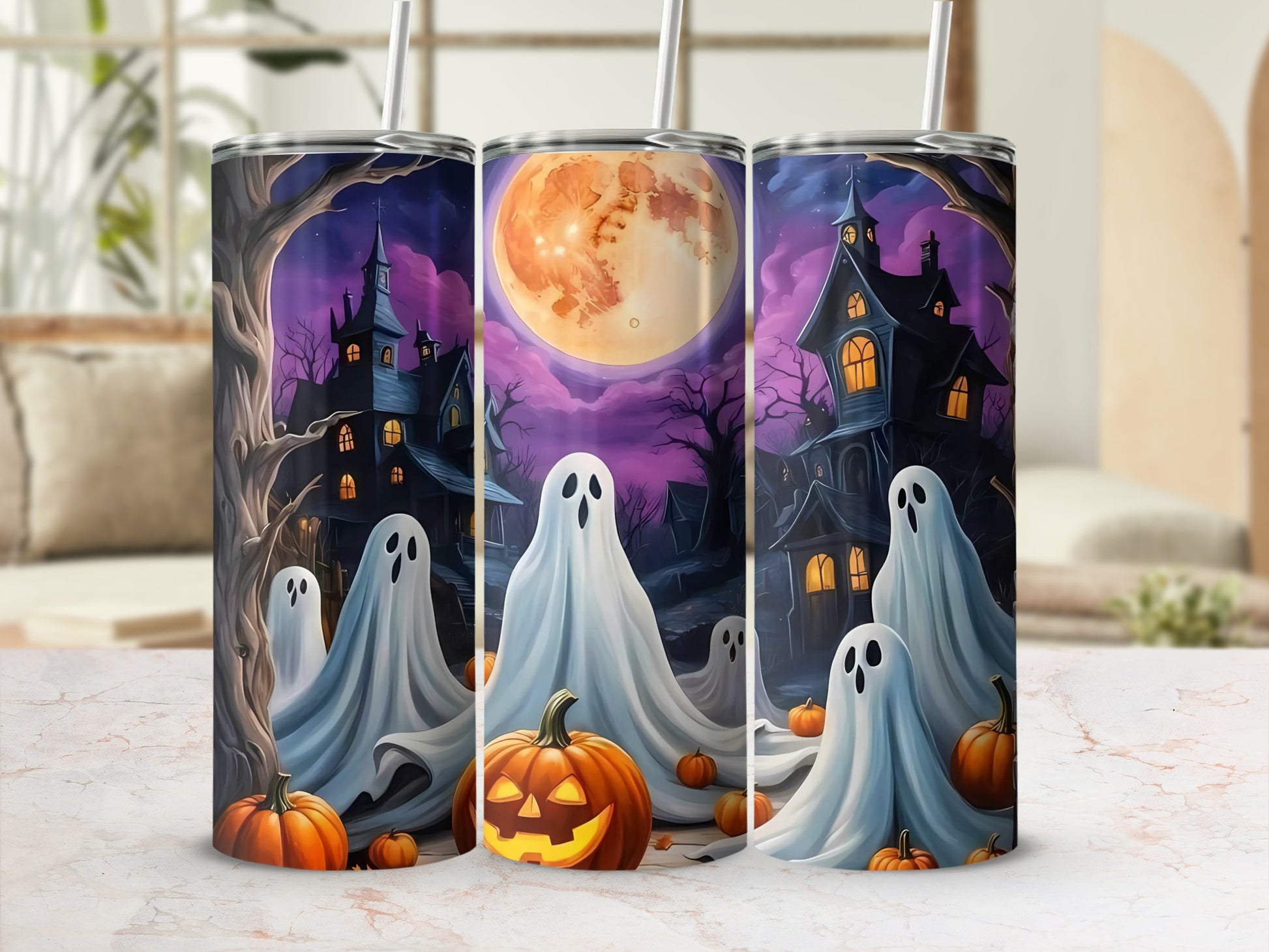 Halloween tumblers with ghosts, haunted houses, pumpkins, and a full moon.