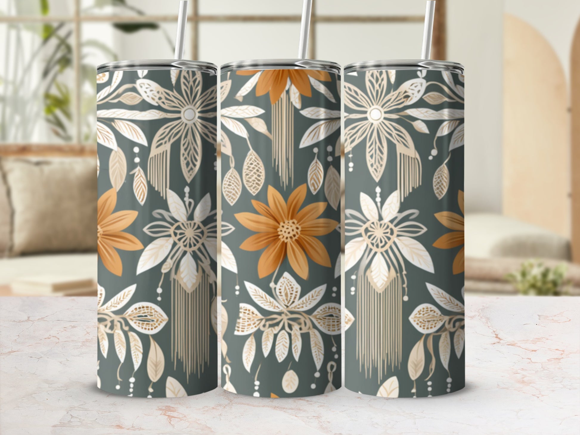 Three tumblers with floral and bohemian patterned design on display.