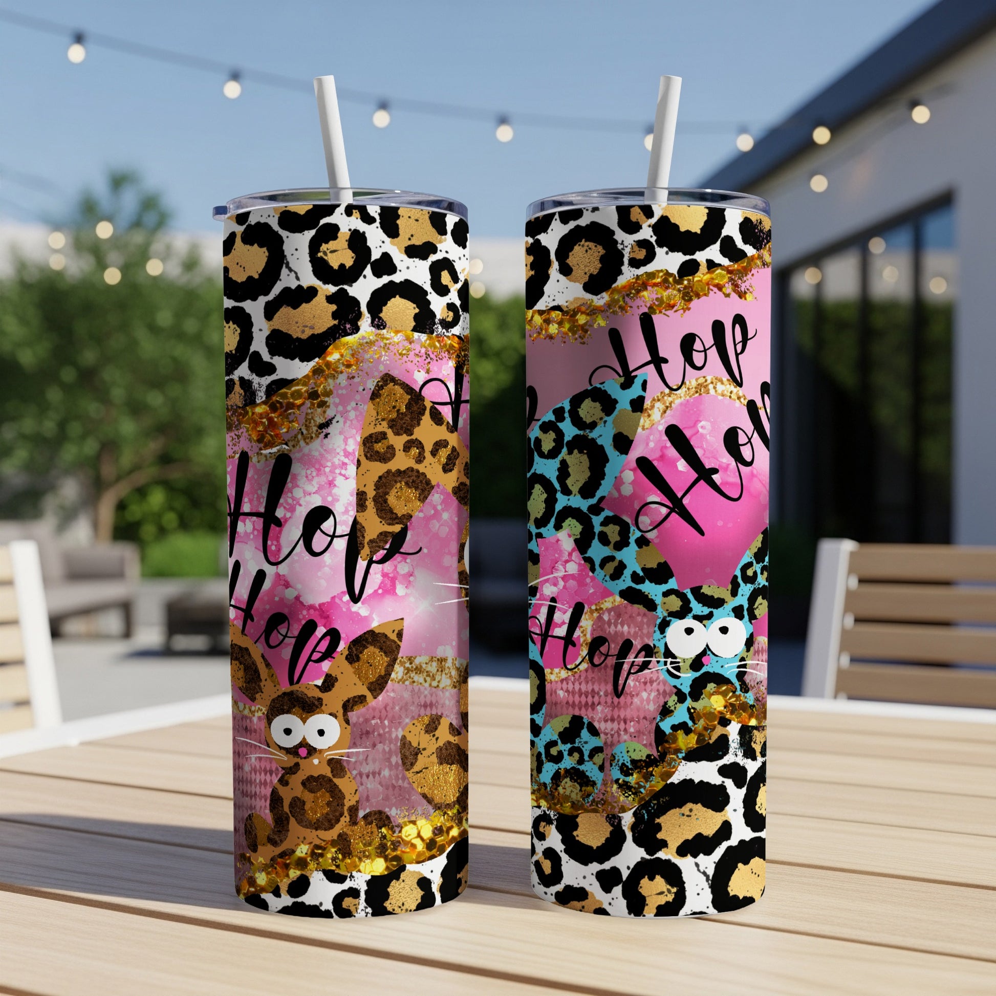 Two pink tumblers with bunny, leopard print, and "Hop" text designs.
