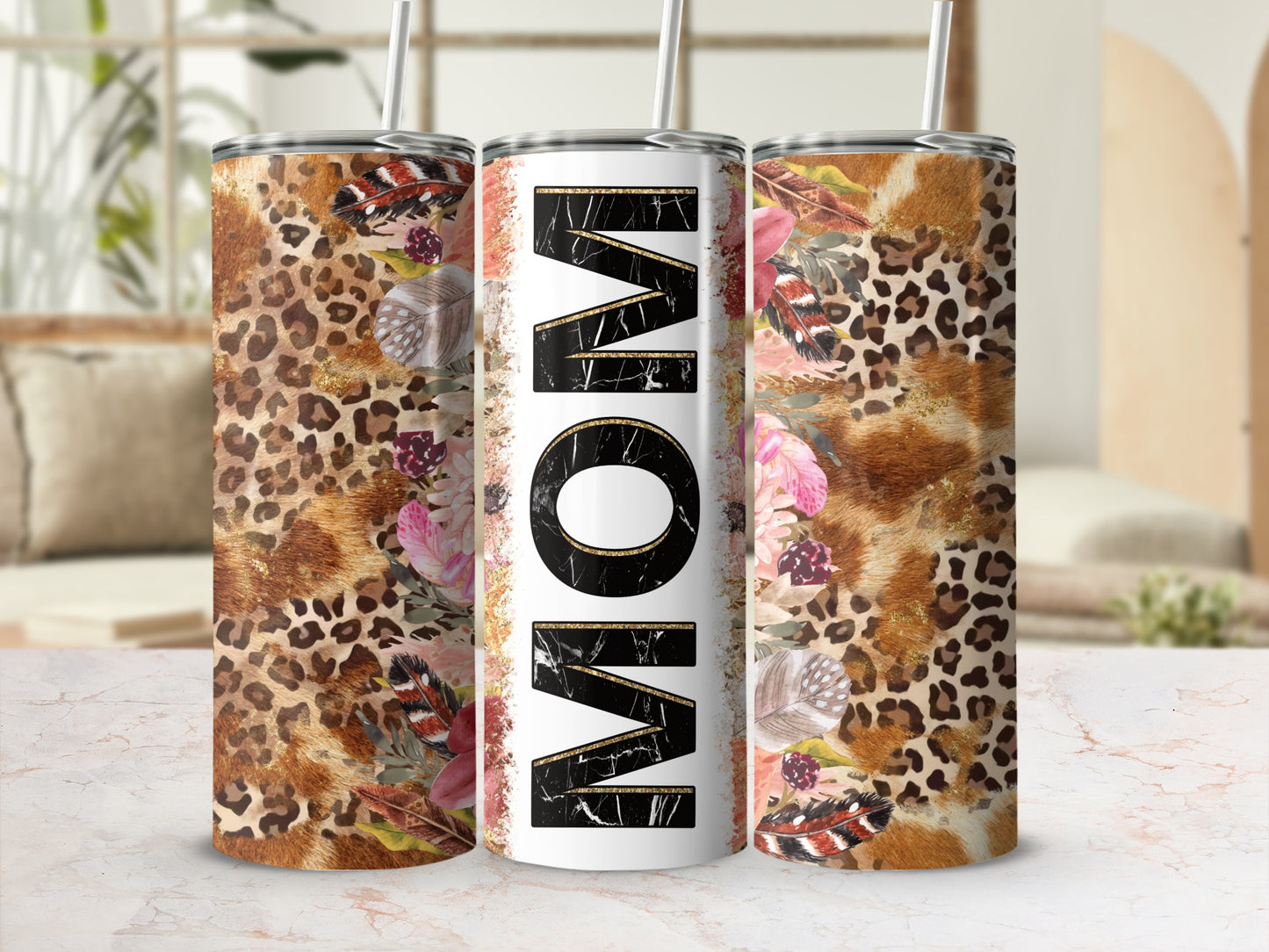 Leopard and floral print tumbler with "MOM" in gold and black lettering.