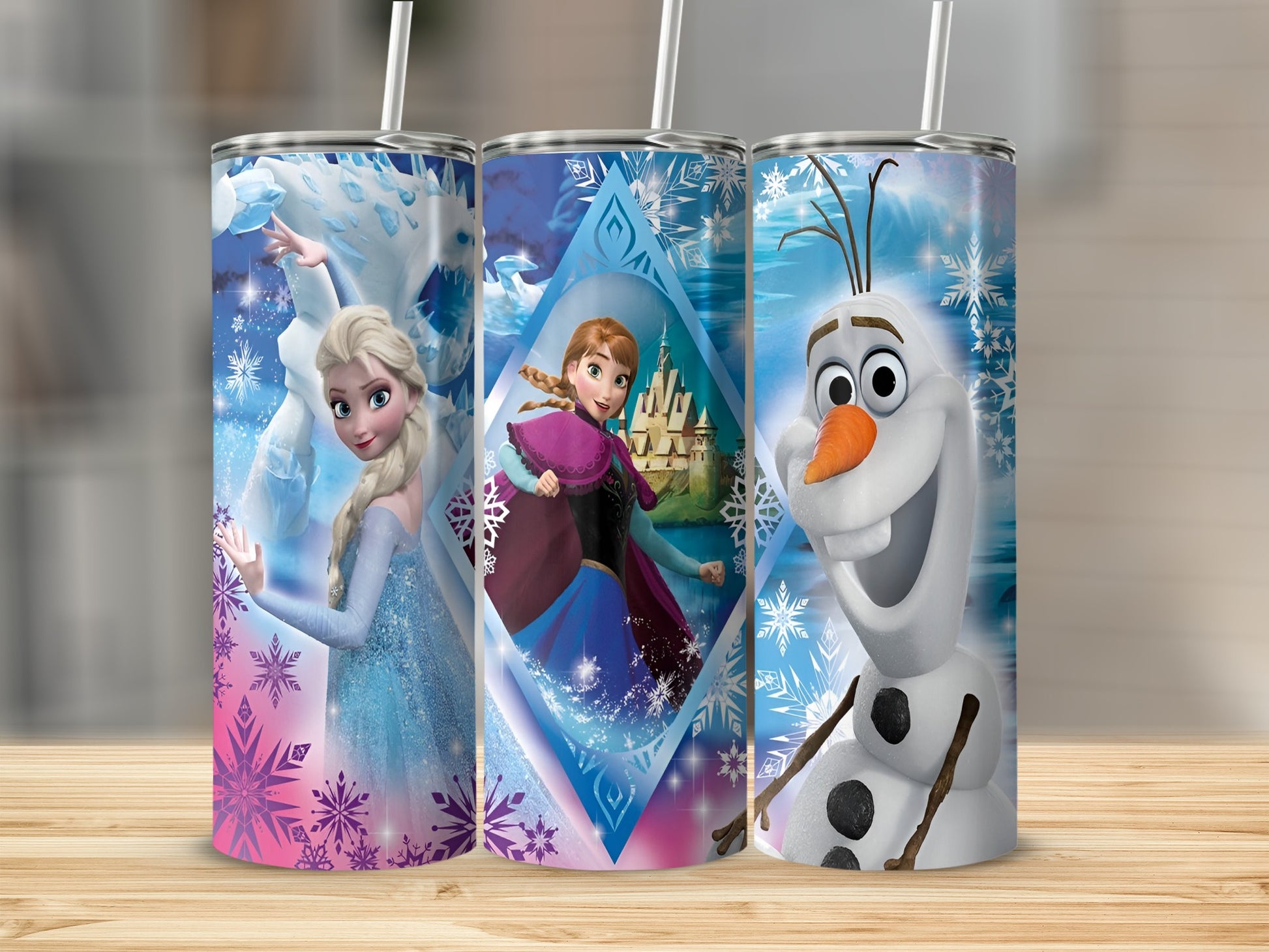 Three Frozen tumblers featuring Elsa, Anna, and Olaf against snowy backgrounds.
