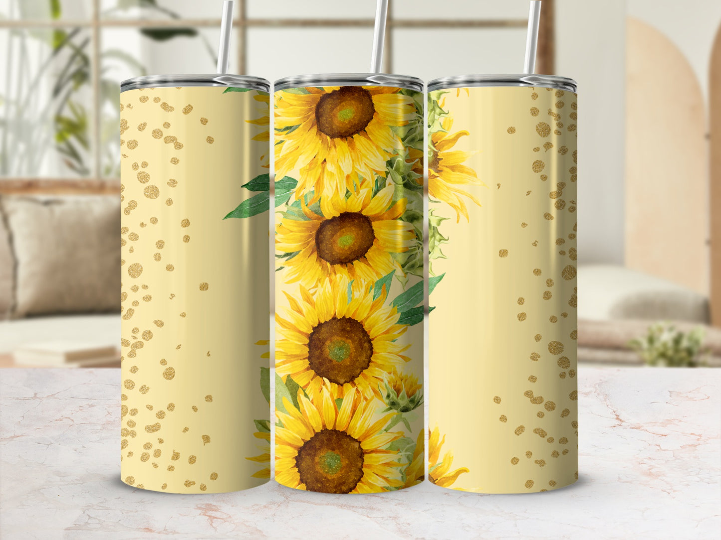 Three tumblers with a sunflower pattern and gold glitter accents.