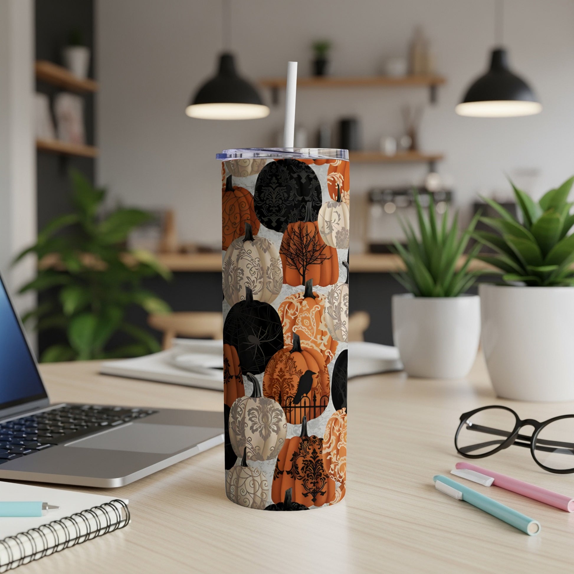 Tumbler with a repeating pattern of pumpkins, damask, and crows.