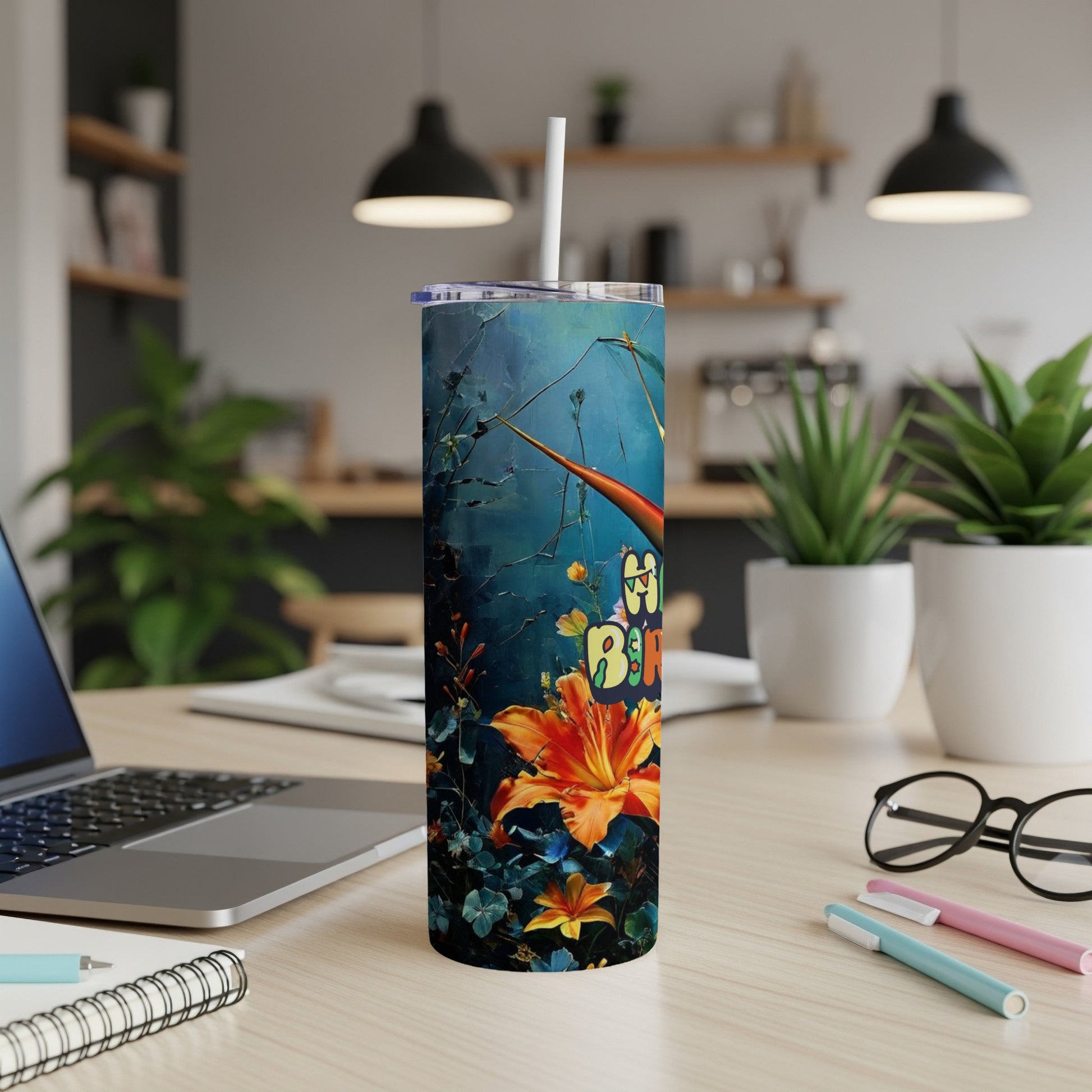 Tumbler with colorful floral and butterfly design.