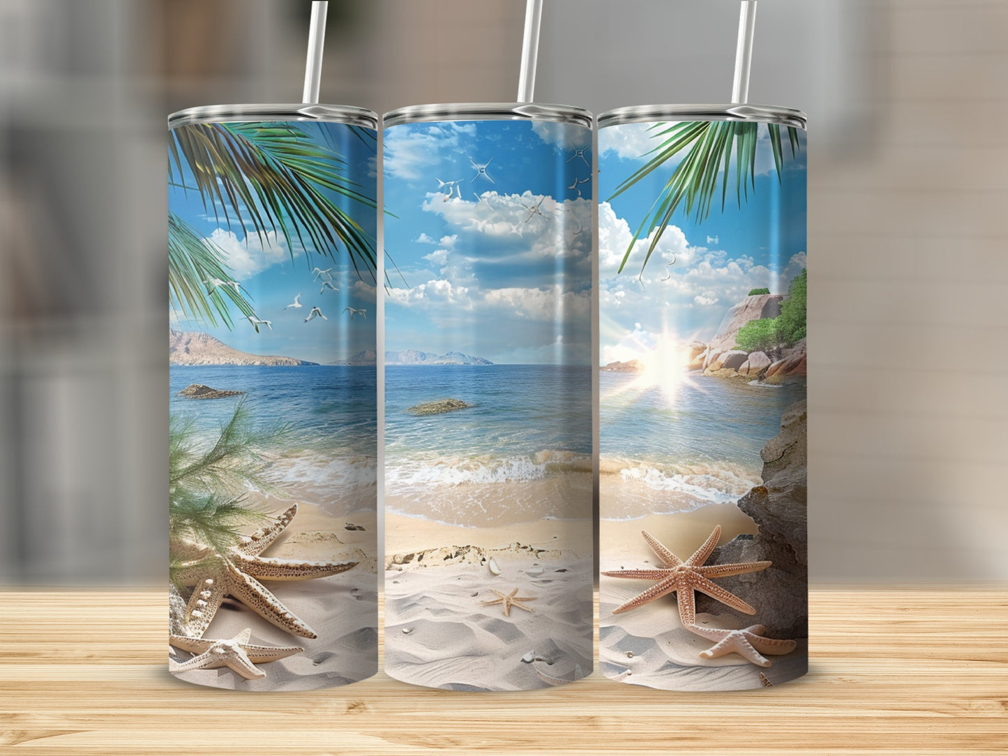 Three tumblers featuring a tropical beach scene with palm trees and starfish.