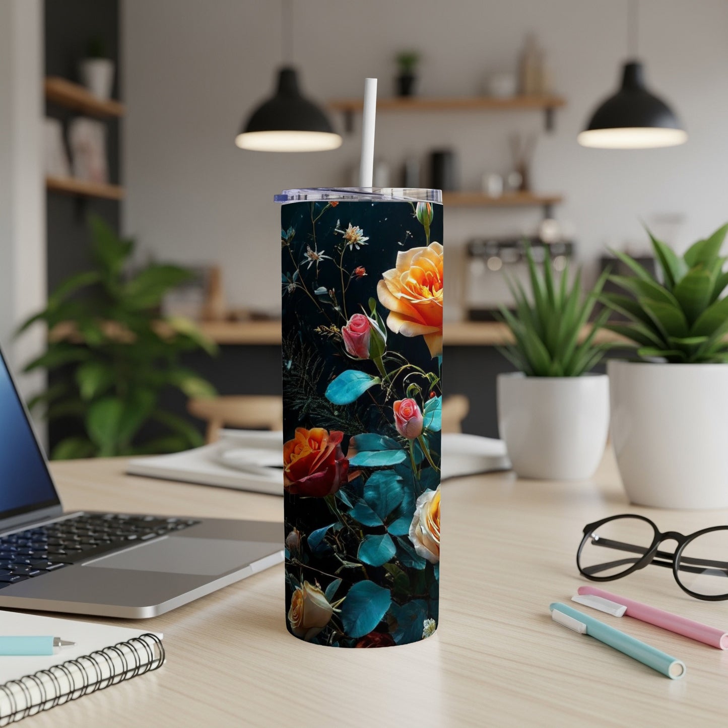 Tall tumbler with colorful roses and leaves on a black background.