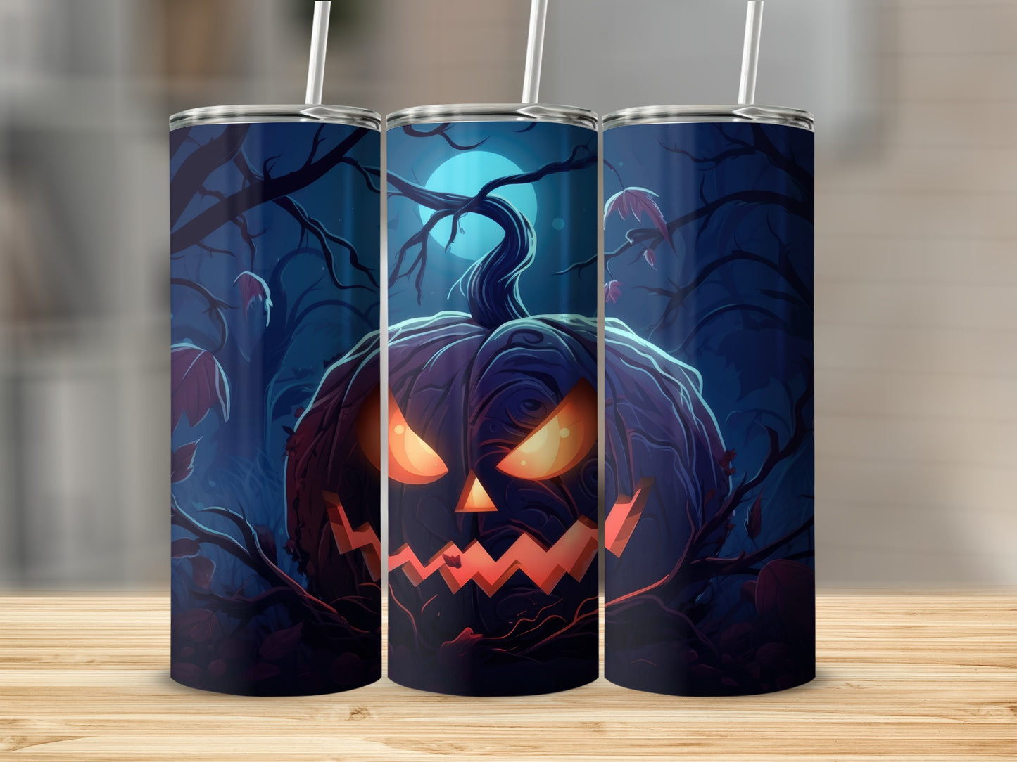 Three tumblers feature a spooky jack-o'-lantern face in a dark, moonlit forest.
