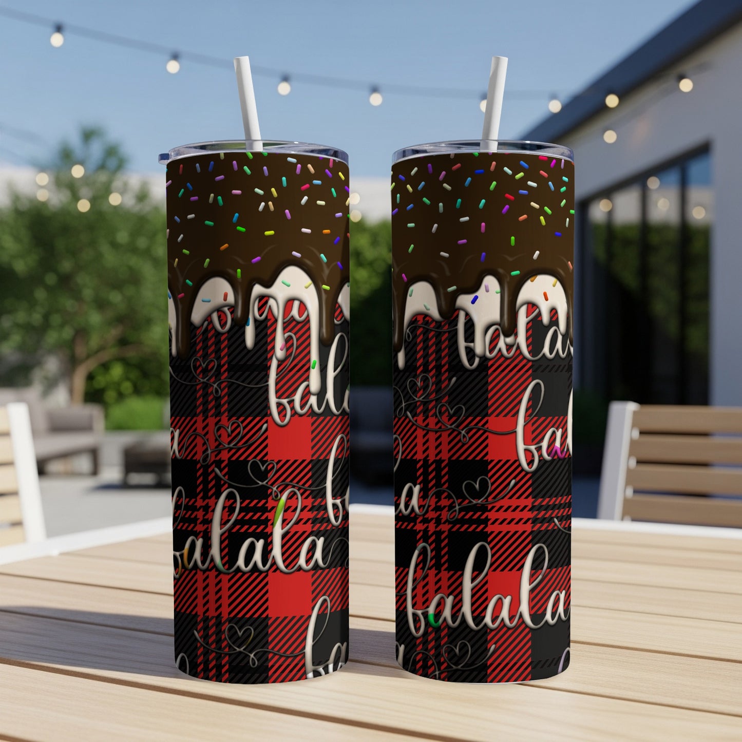 Two tumblers with chocolate drip, sprinkles, and "fa la la" text on plaid.