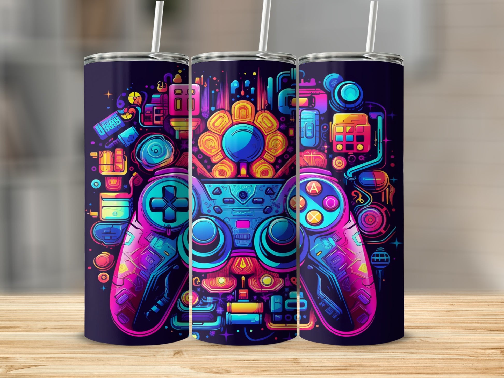 Three tumblers with colorful video game controller designs.