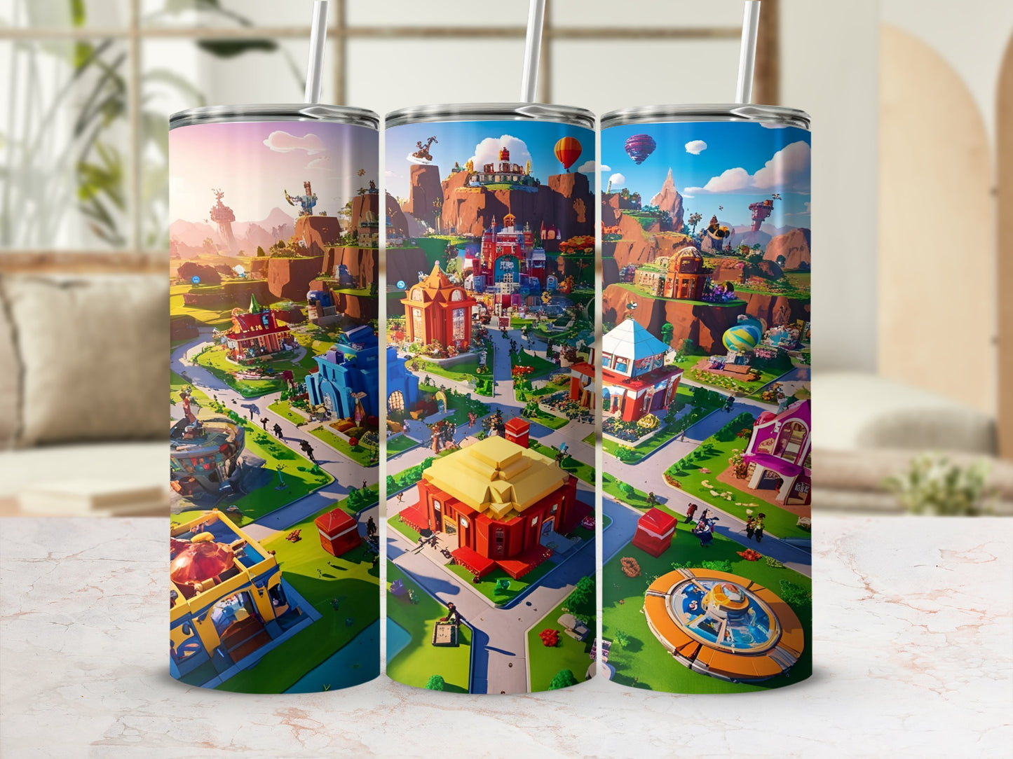 Three tumblers displaying a colorful cartoon village with buildings, trees, and hot air balloons.