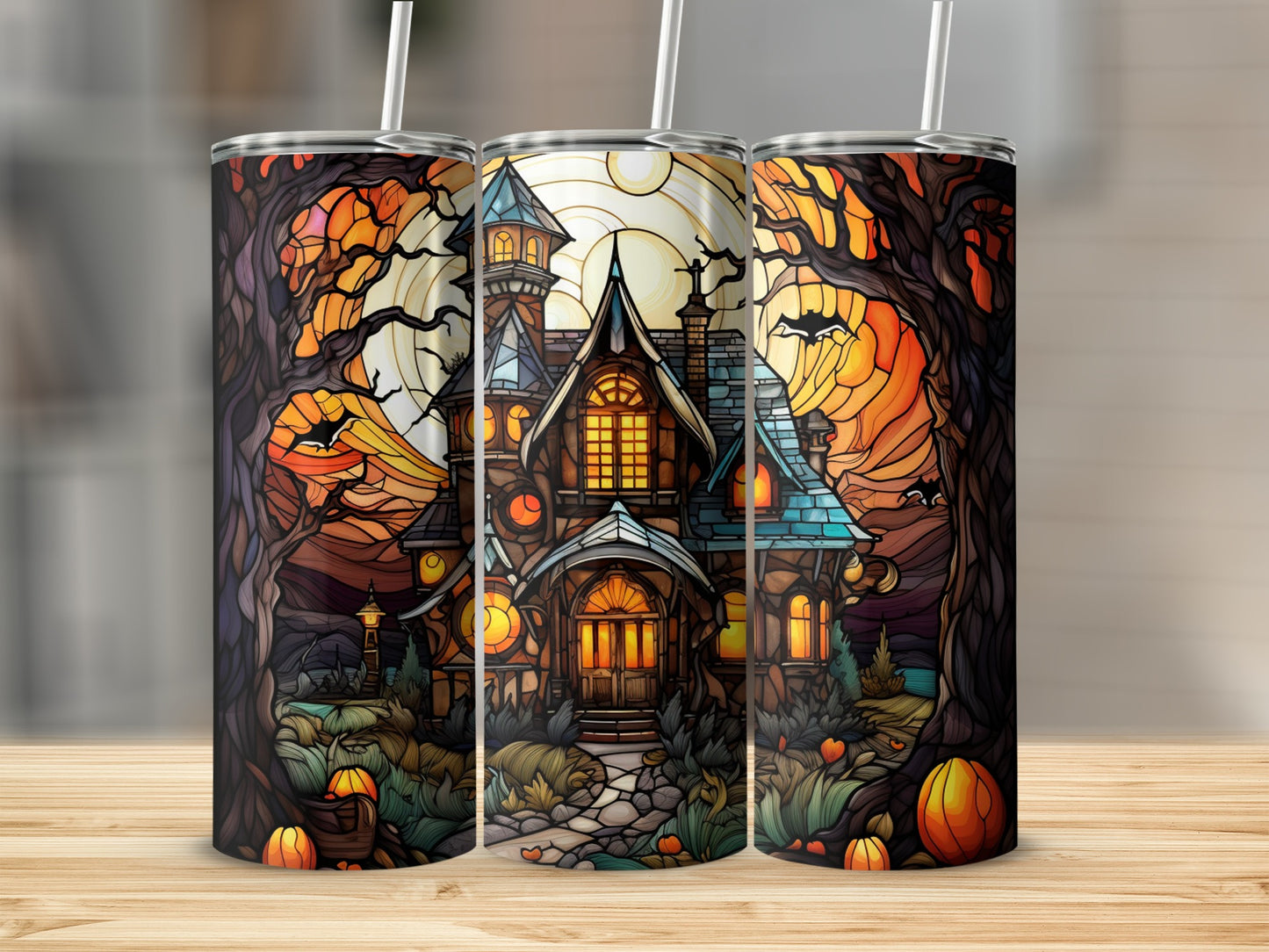 Haunted house with stained glass style and pumpkins, three tumblers displayed.