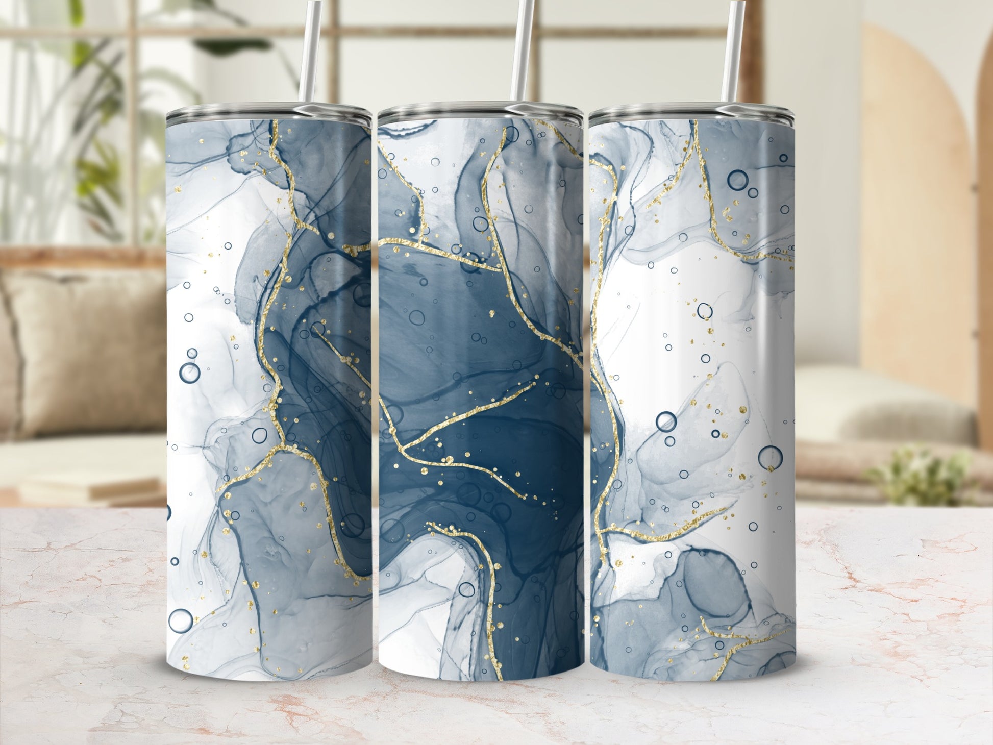 Three tumblers with abstract blue and gold marble pattern.