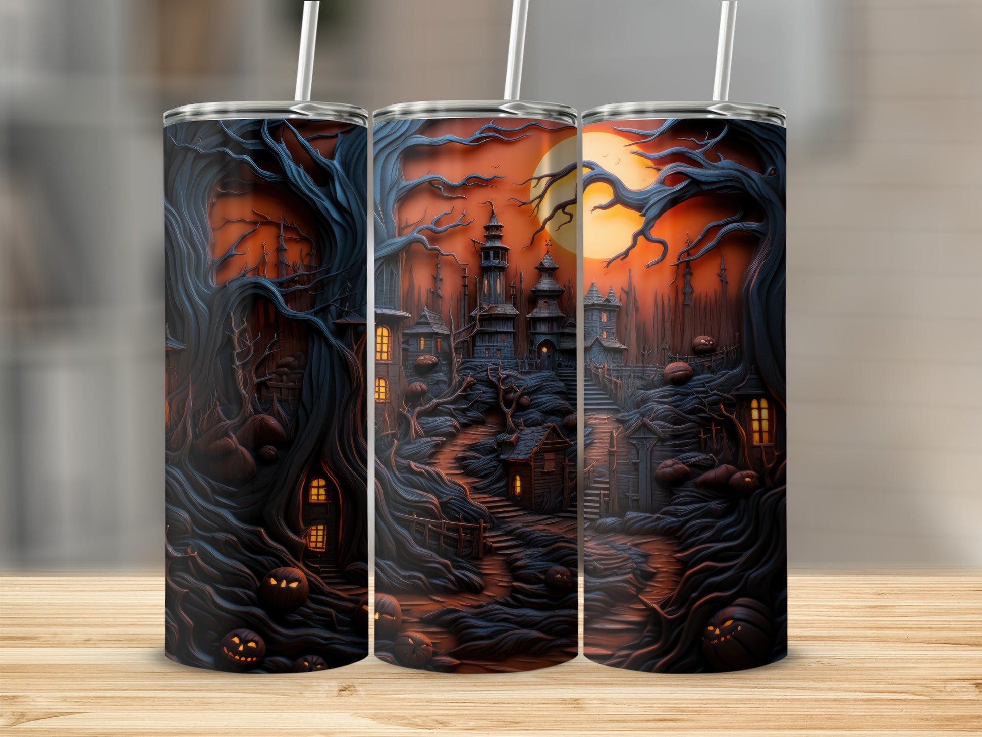 Three tumblers with a spooky haunted Halloween scene featuring a castle, pumpkins, and gnarled trees.