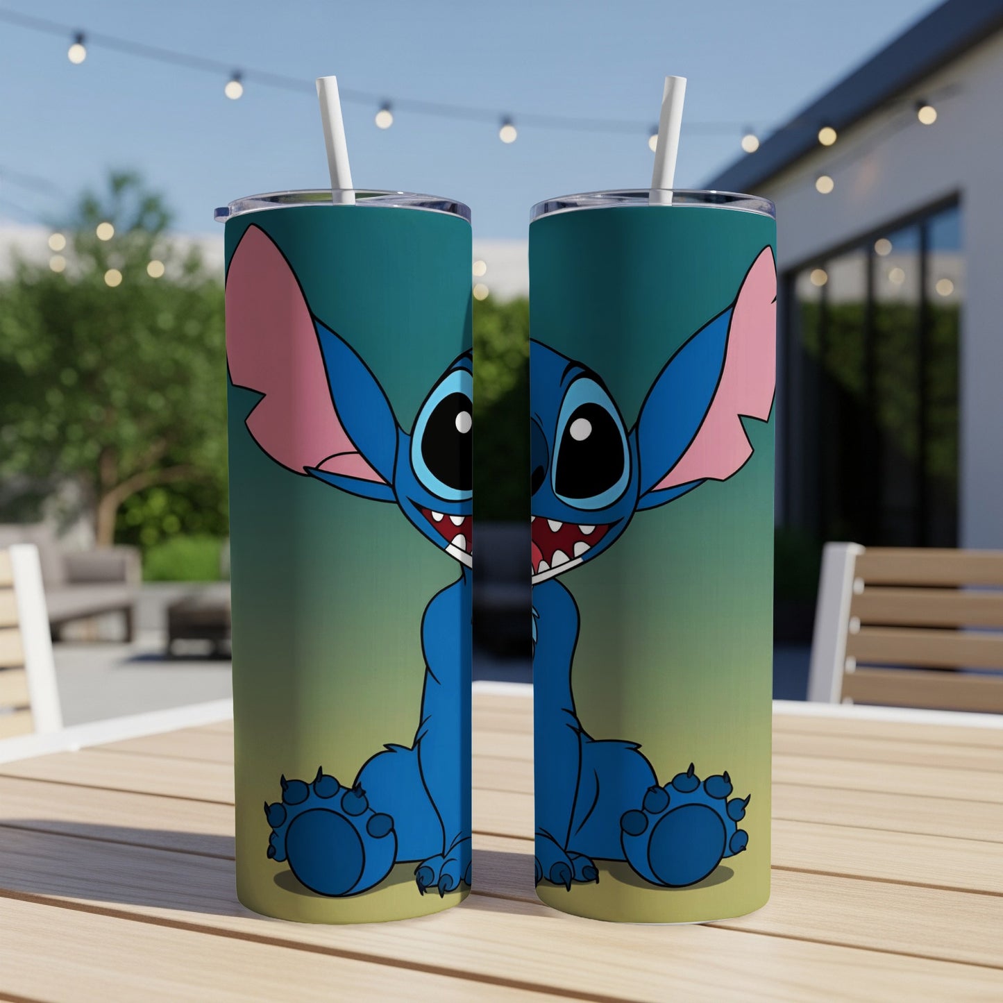 Blue Stitch character on two identical tumblers with straws outdoors.