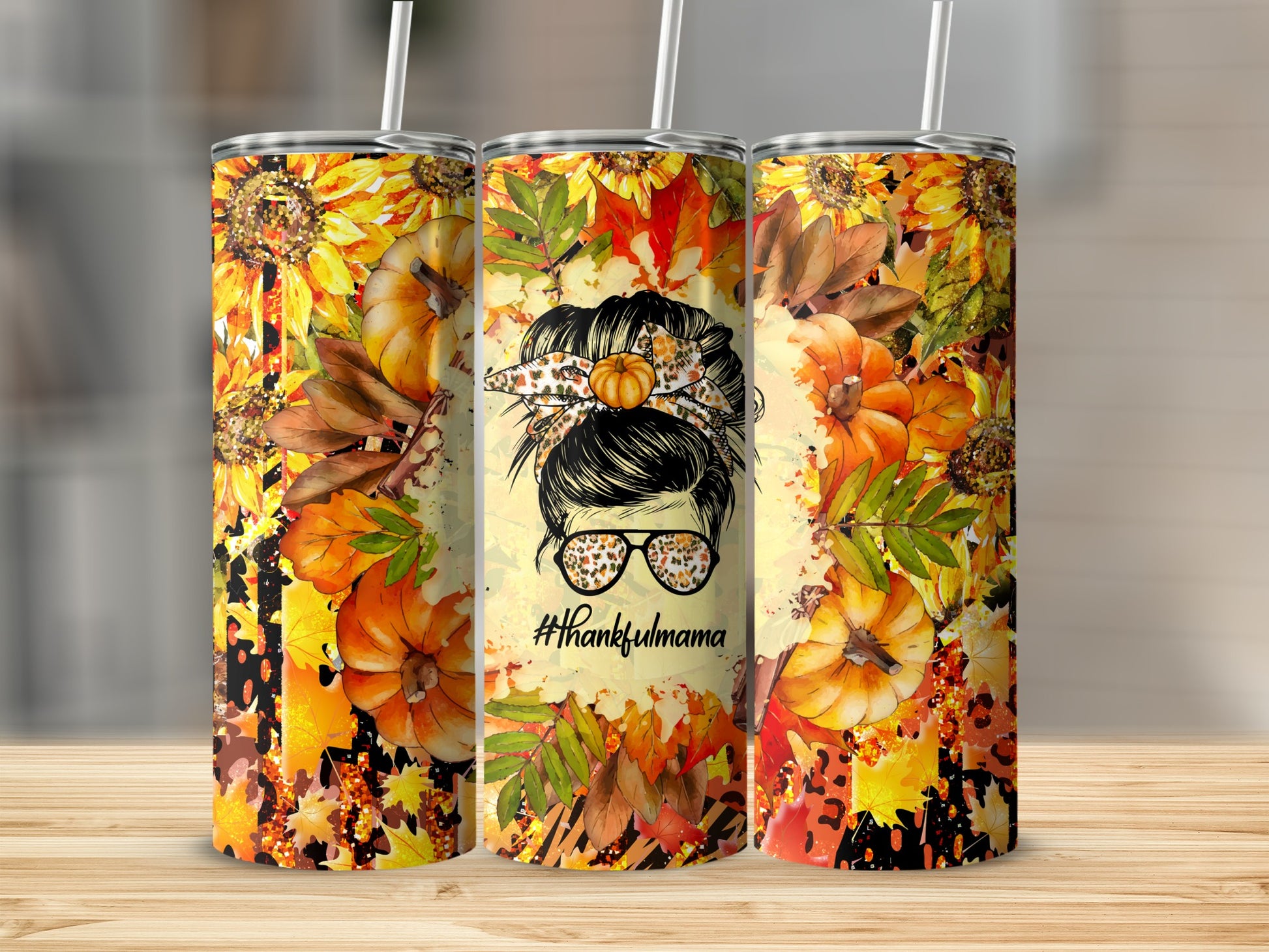 Tumbler with fall leaves, sunflowers, pumpkins, and a messy bun graphic with #thankfulmama.