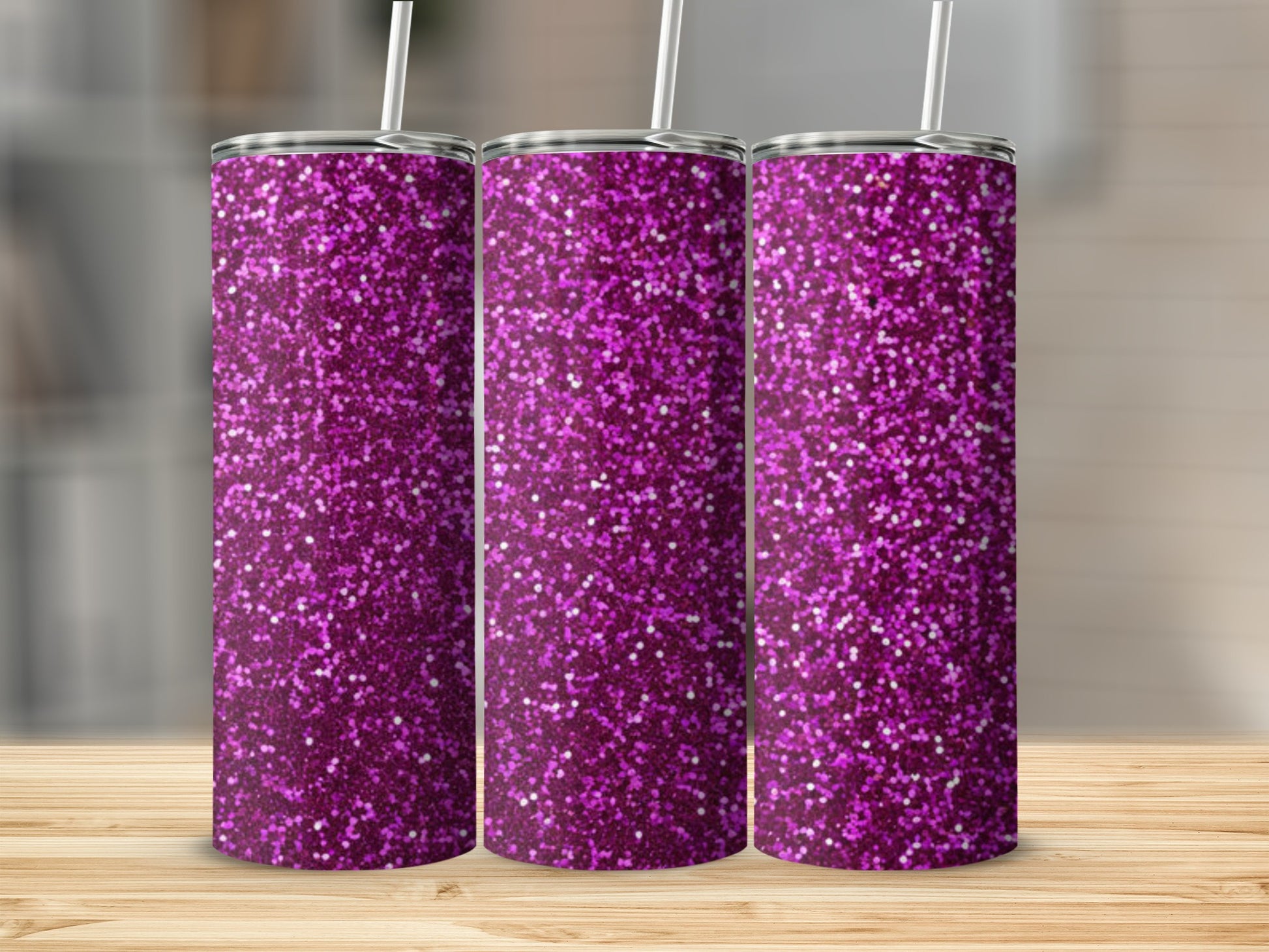 Three tall tumblers with purple glitter and white straws.