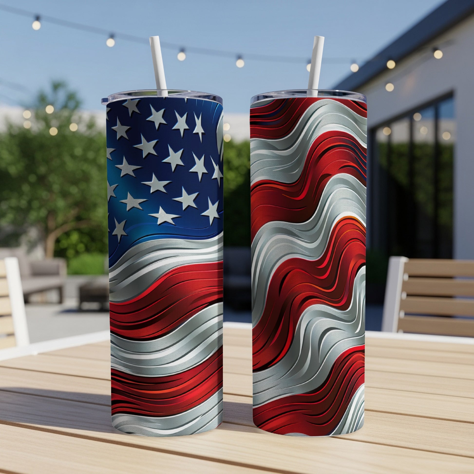 Two tumblers with American flag design on a wooden table outdoors.