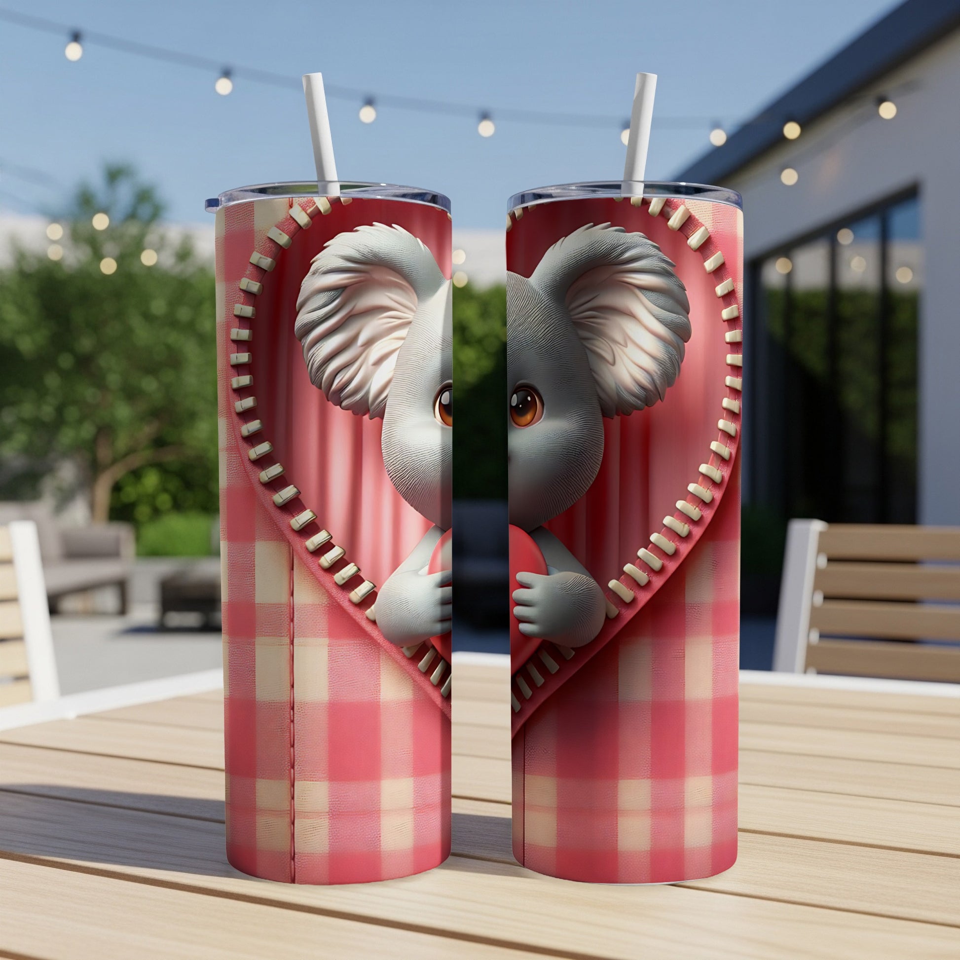 Two tumblers with a cartoon koala peeking from a zippered heart.