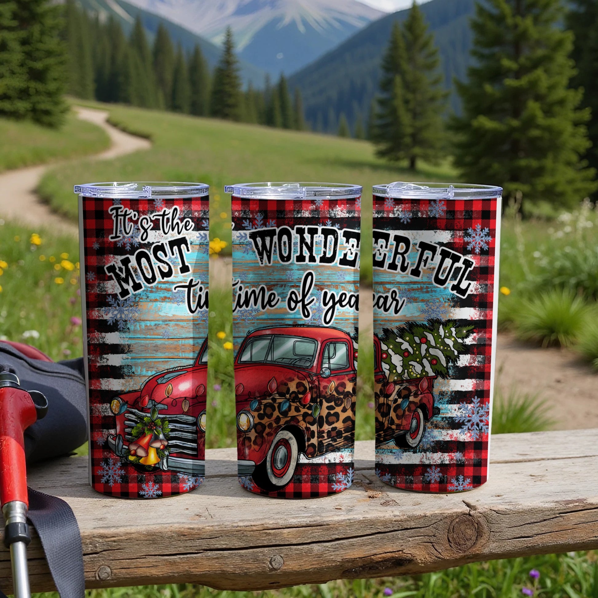 Three tumblers with red plaid, vintage truck, and Christmas tree designs.