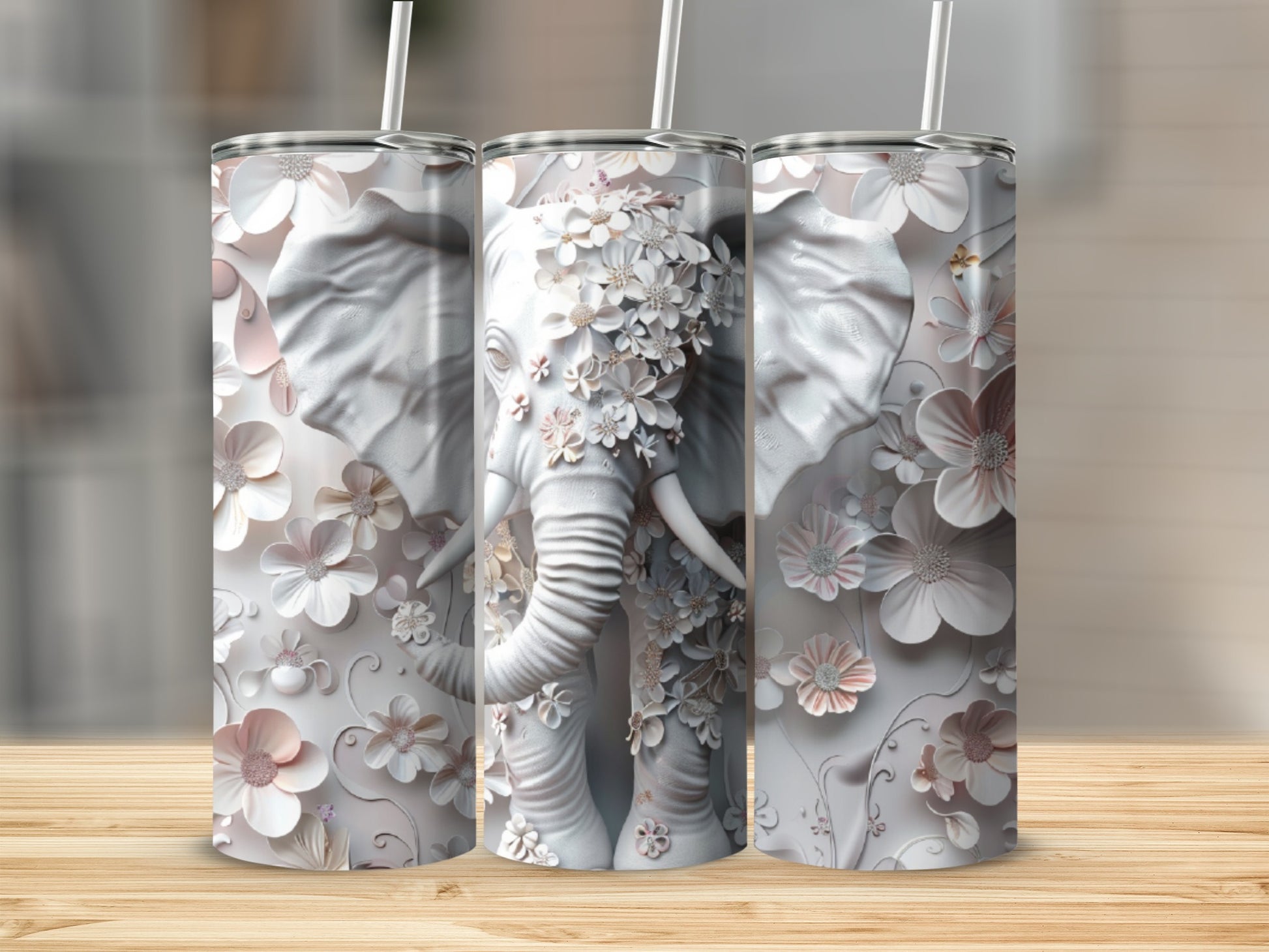 White elephant tumbler with embossed floral details and straw.