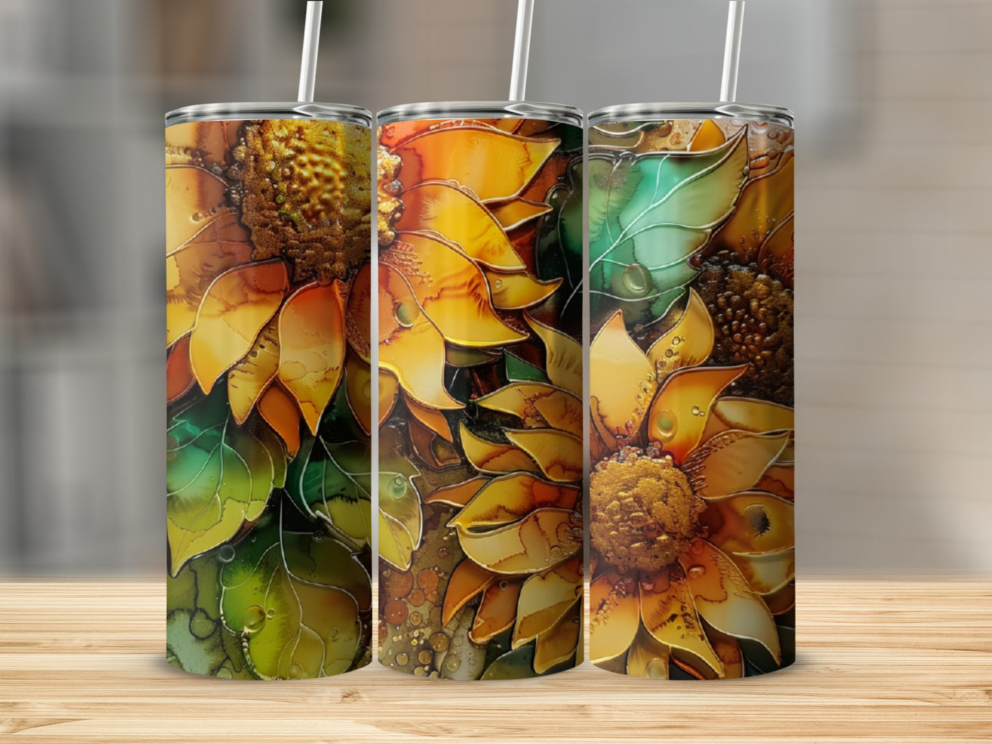 Three tumblers with abstract sunflower designs and watercolor-like details.