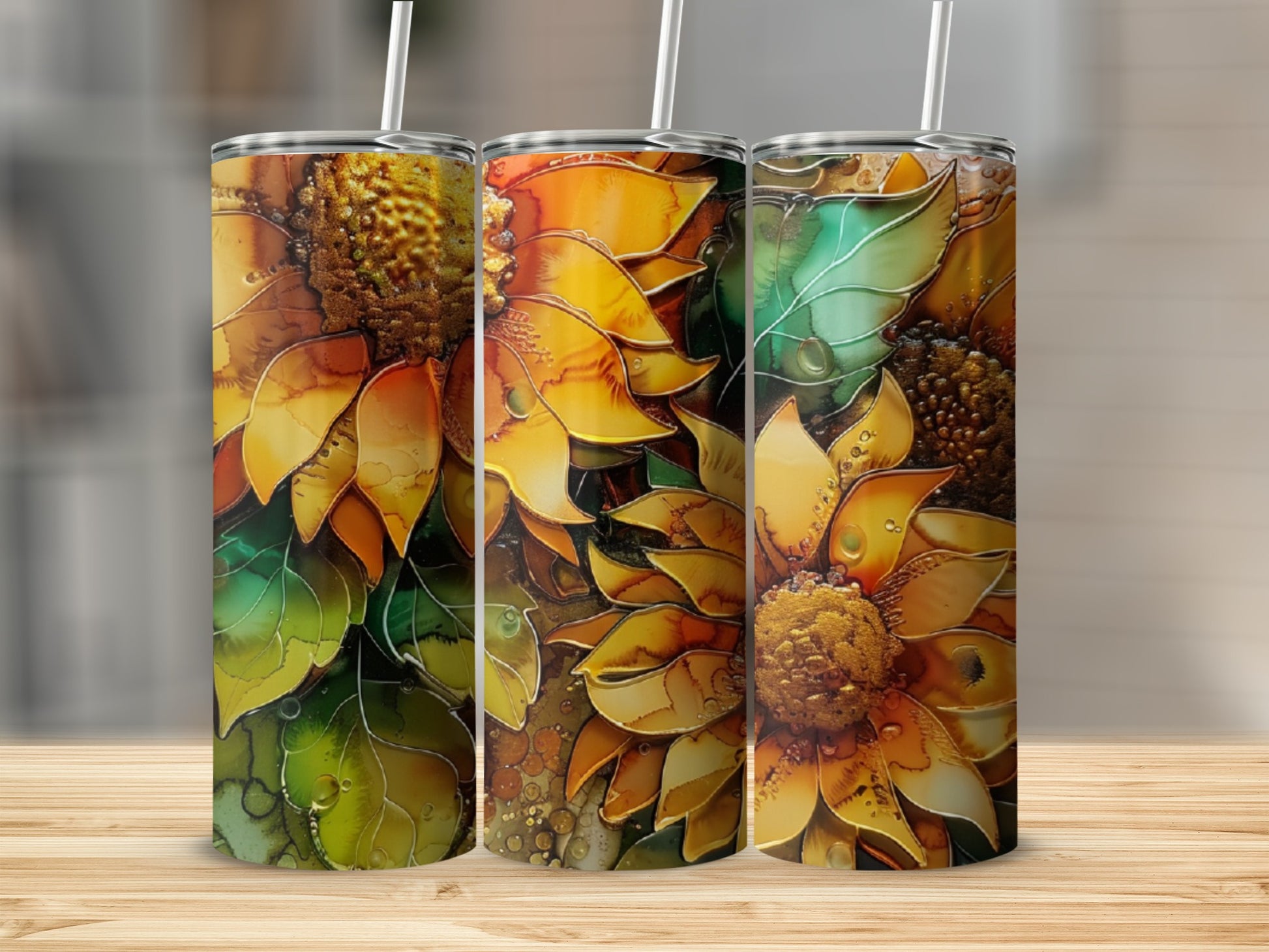 Three tumblers with abstract sunflower designs and watercolor-like details.