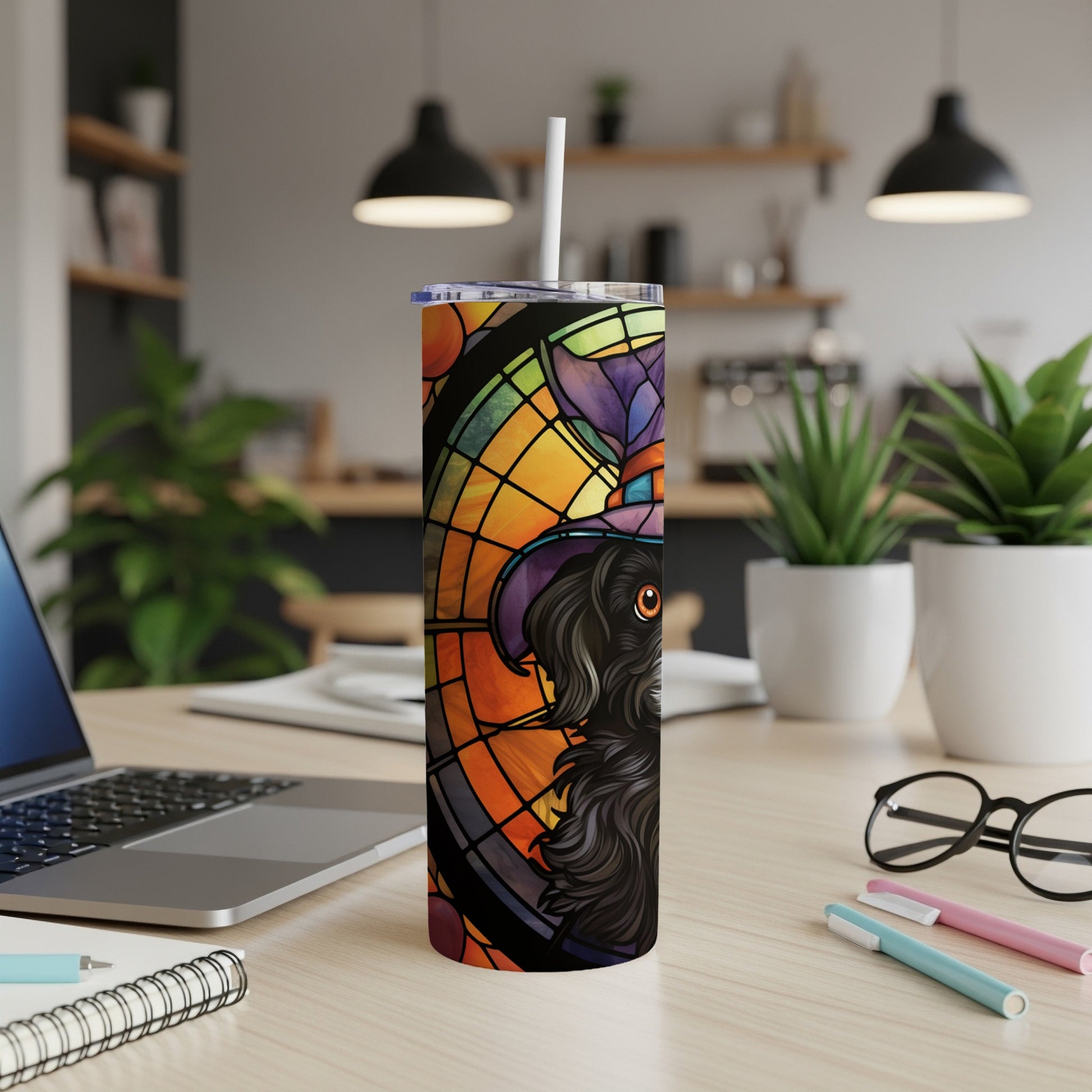 Black dog wearing a witch hat, stained glass design, on a tumbler.