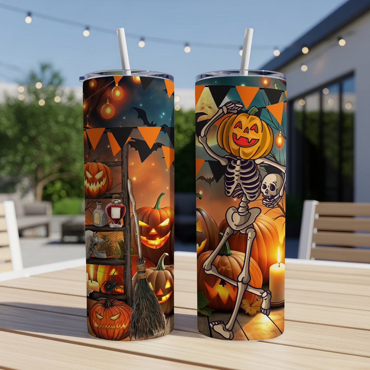 Two tumblers with Halloween skeletons, pumpkins, and spooky decorations.