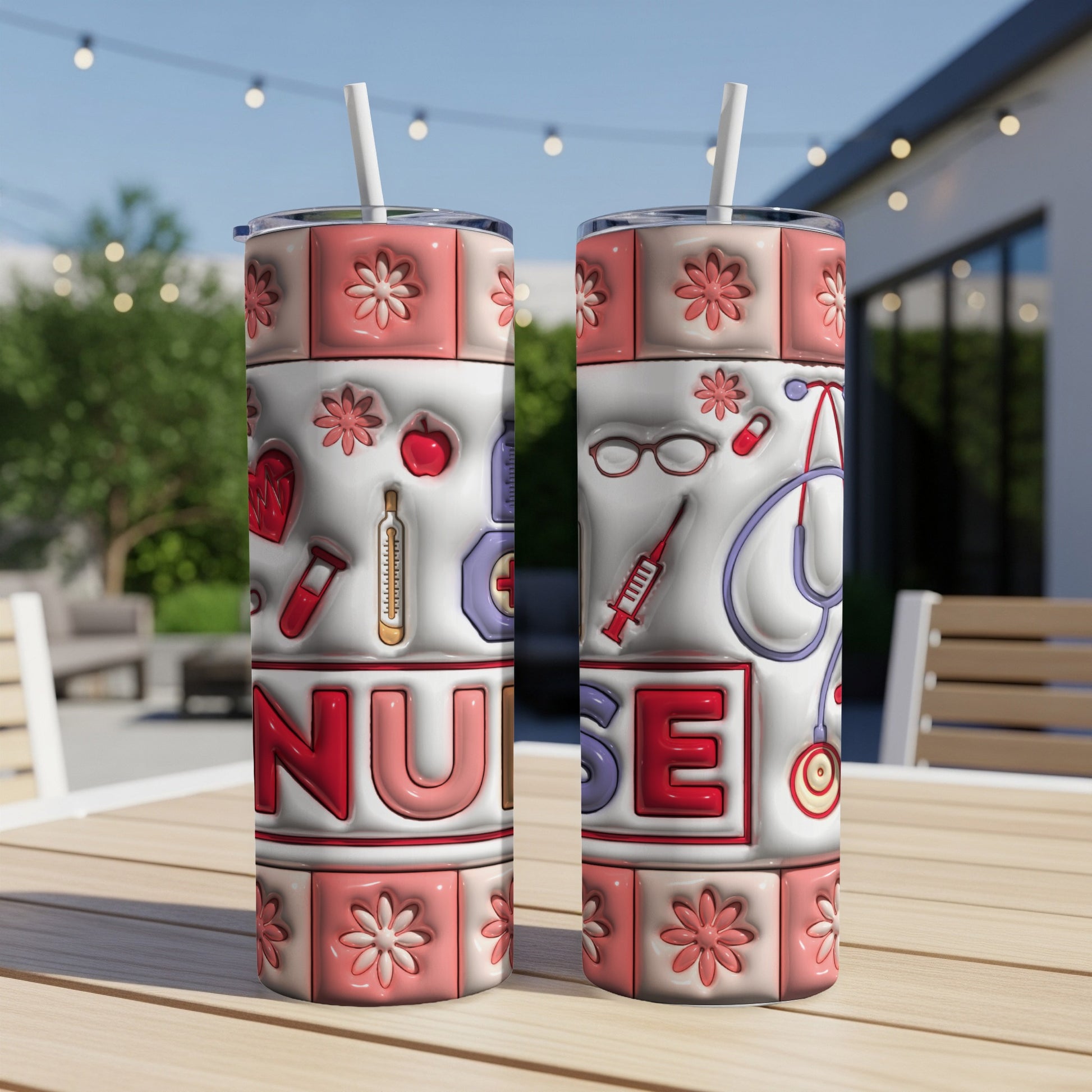 Two nurse-themed tumblers with medical icons and floral patterns on a table.