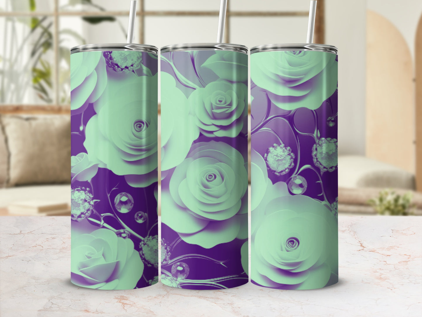 Three mint green tumblers with rose floral pattern on a marble surface.