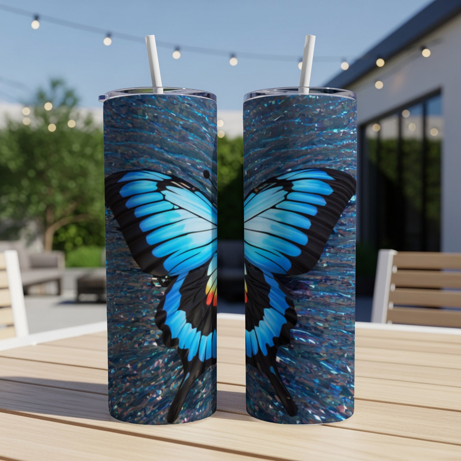 Two tumblers with vibrant blue butterfly wings against a textured background.