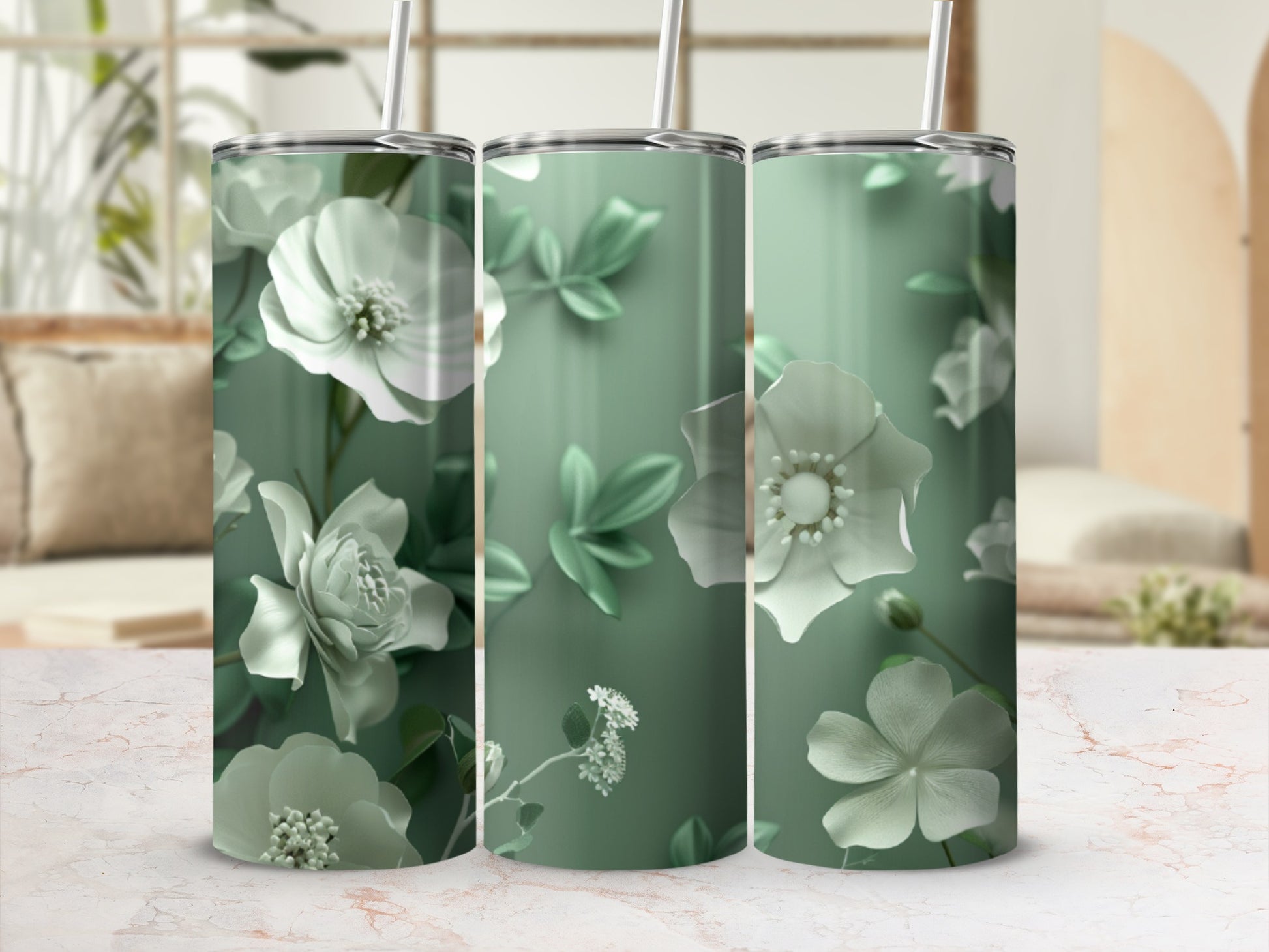 Three tumblers with a white floral and green leaf design on a light green background.