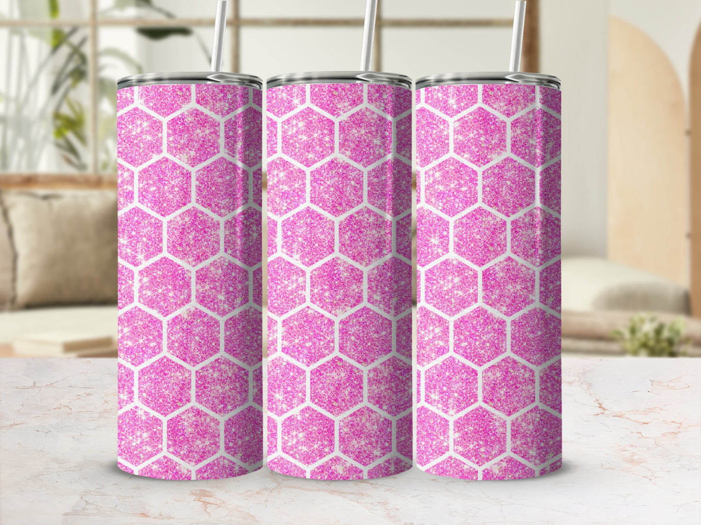 Three tumblers with pink glitter hexagon pattern, featuring white straws.