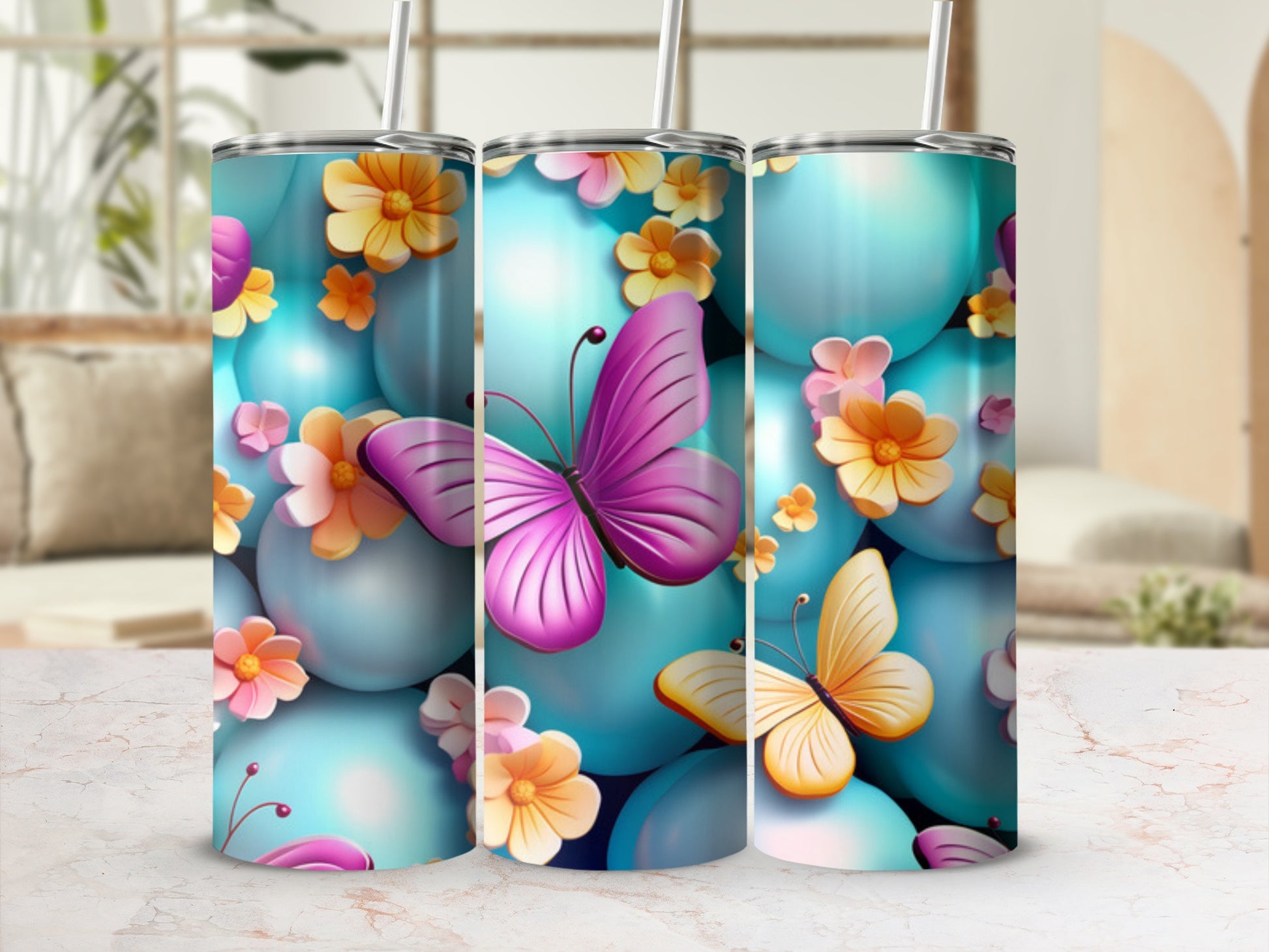 Tumbler with pink and orange butterflies and floral accents on blue spheres.