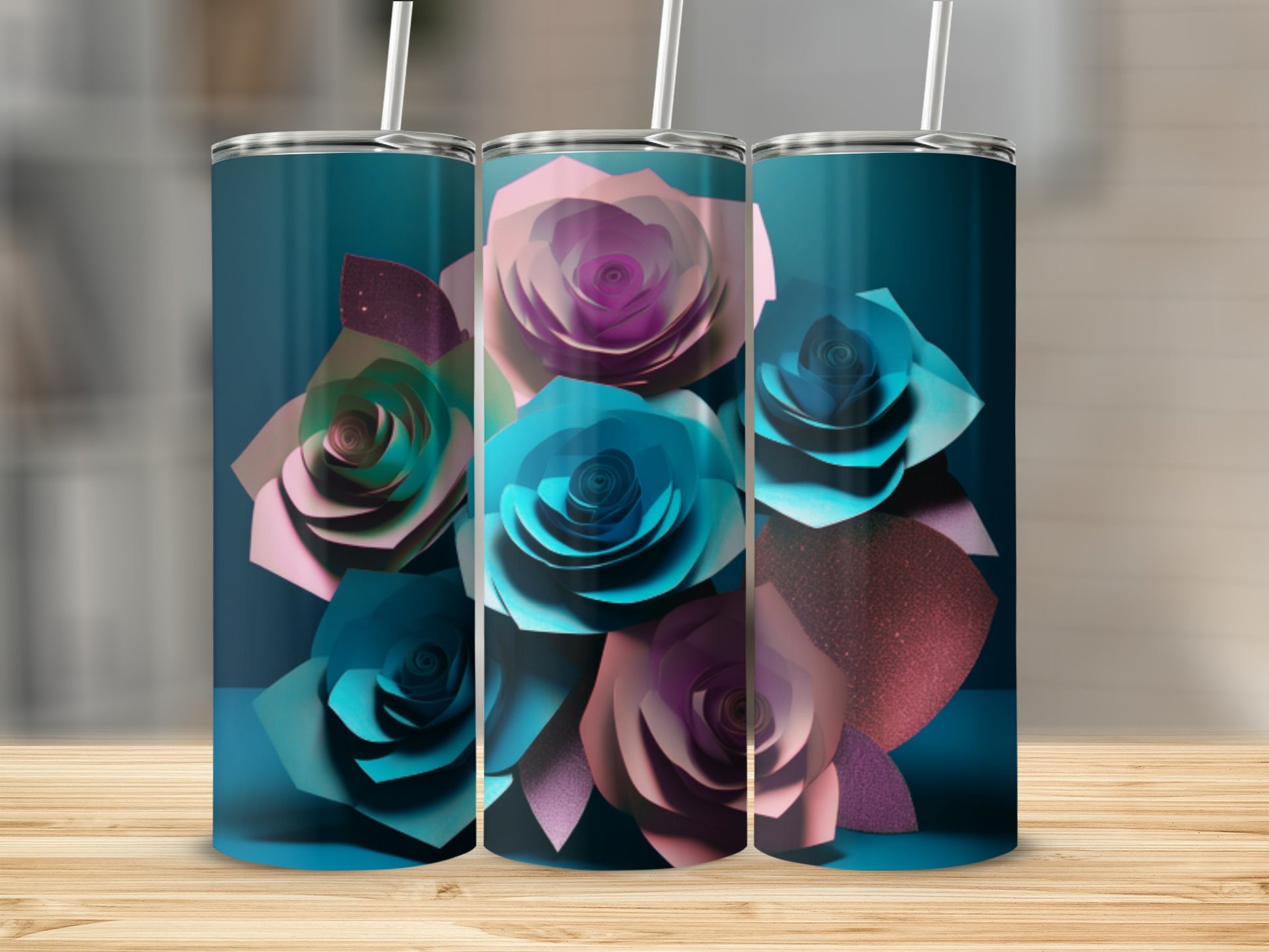 Three tumblers with a floral design of pink and teal paper roses.