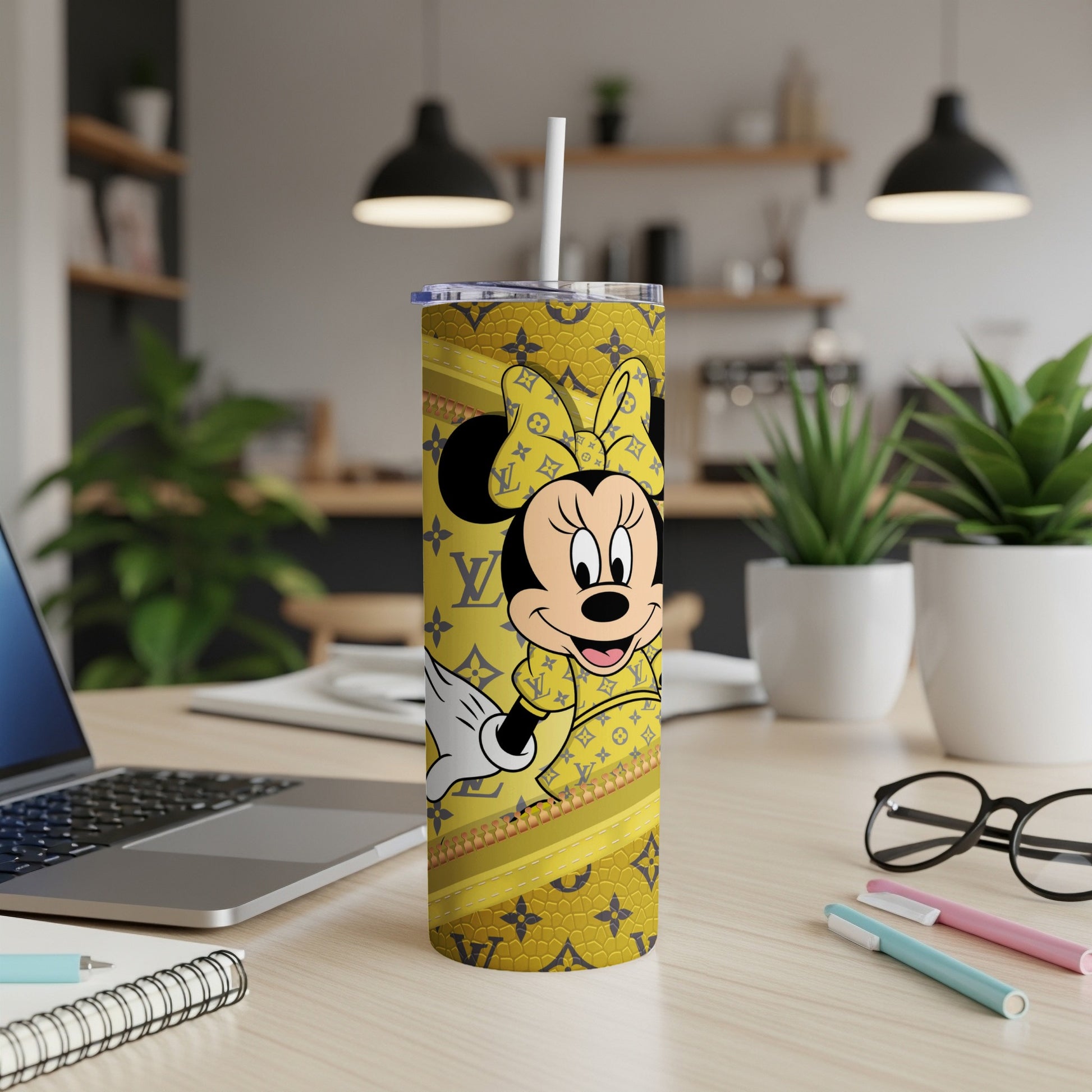 Minnie Mouse on a yellow tumbler with LV-inspired pattern and straw.