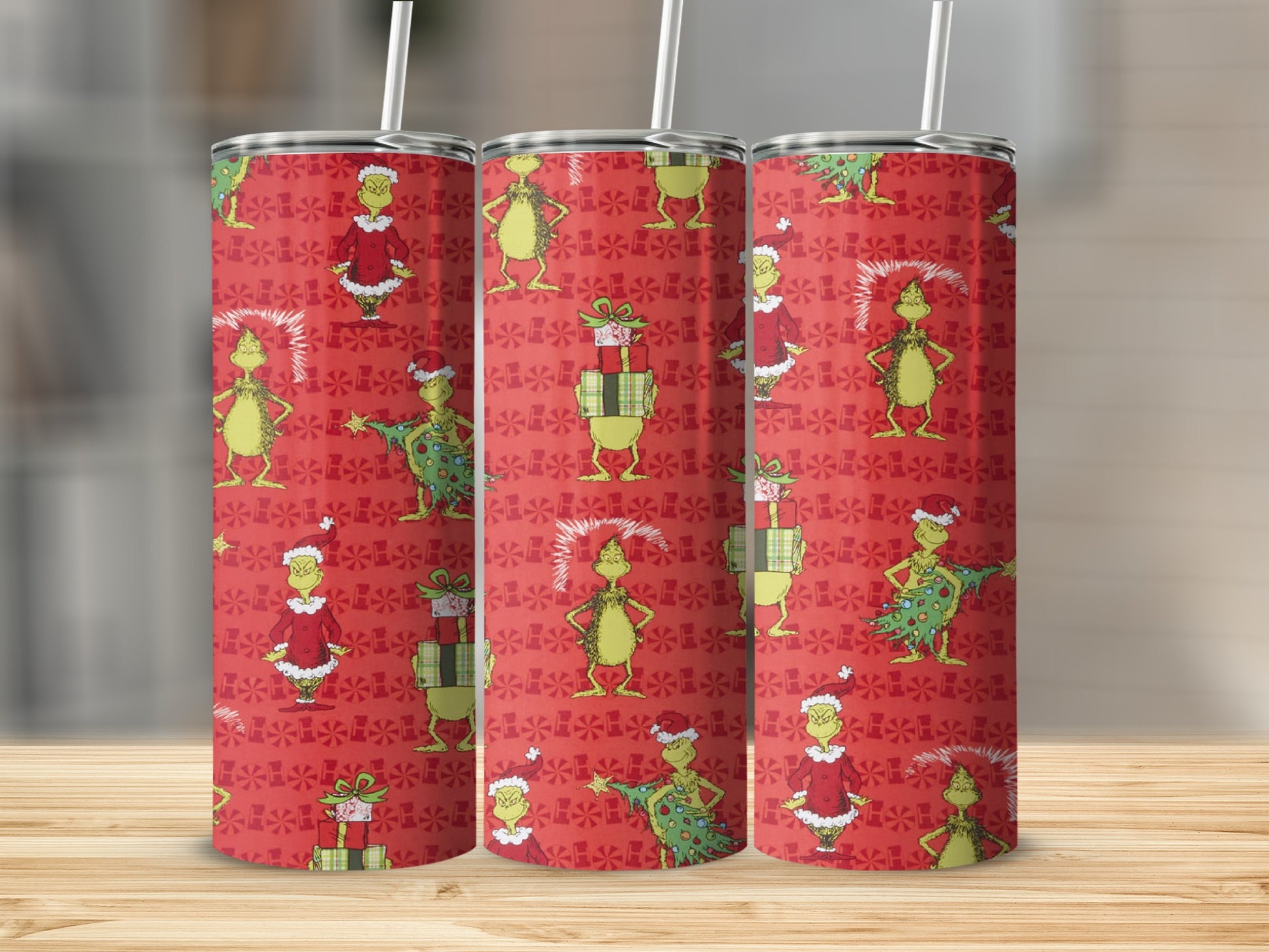 Grinch pattern on red tumbler with green gifts and Christmas trees.