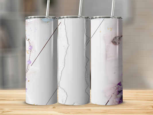 Three tall, slender tumblers with a floral and glitter design.