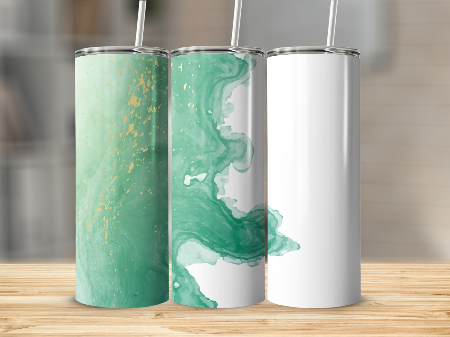 Three tumblers with green watercolor and gold accents, one blank.